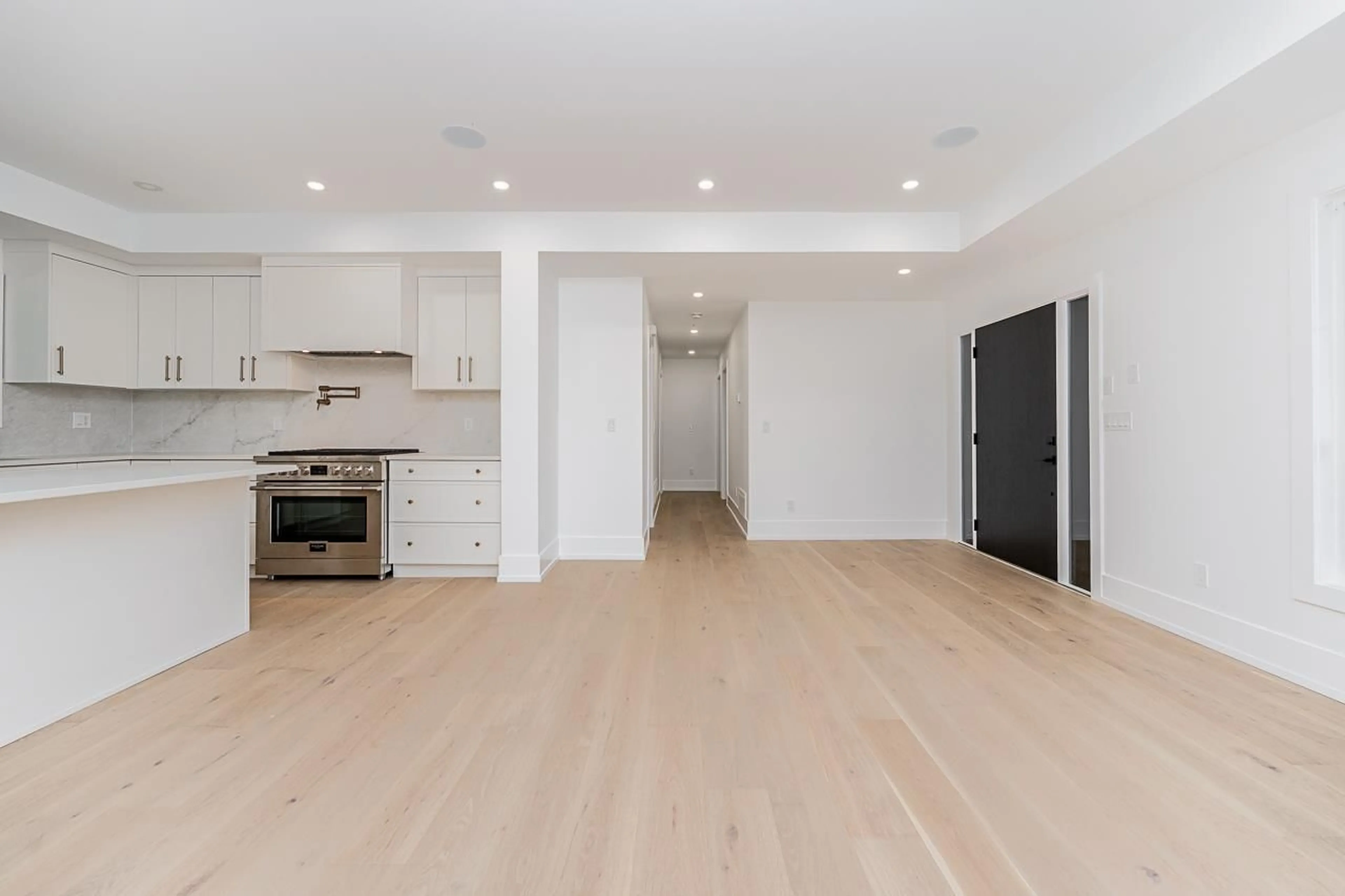 Open concept kitchen, wood/laminate floor for 24430 56, Langley British Columbia V2Z1E9