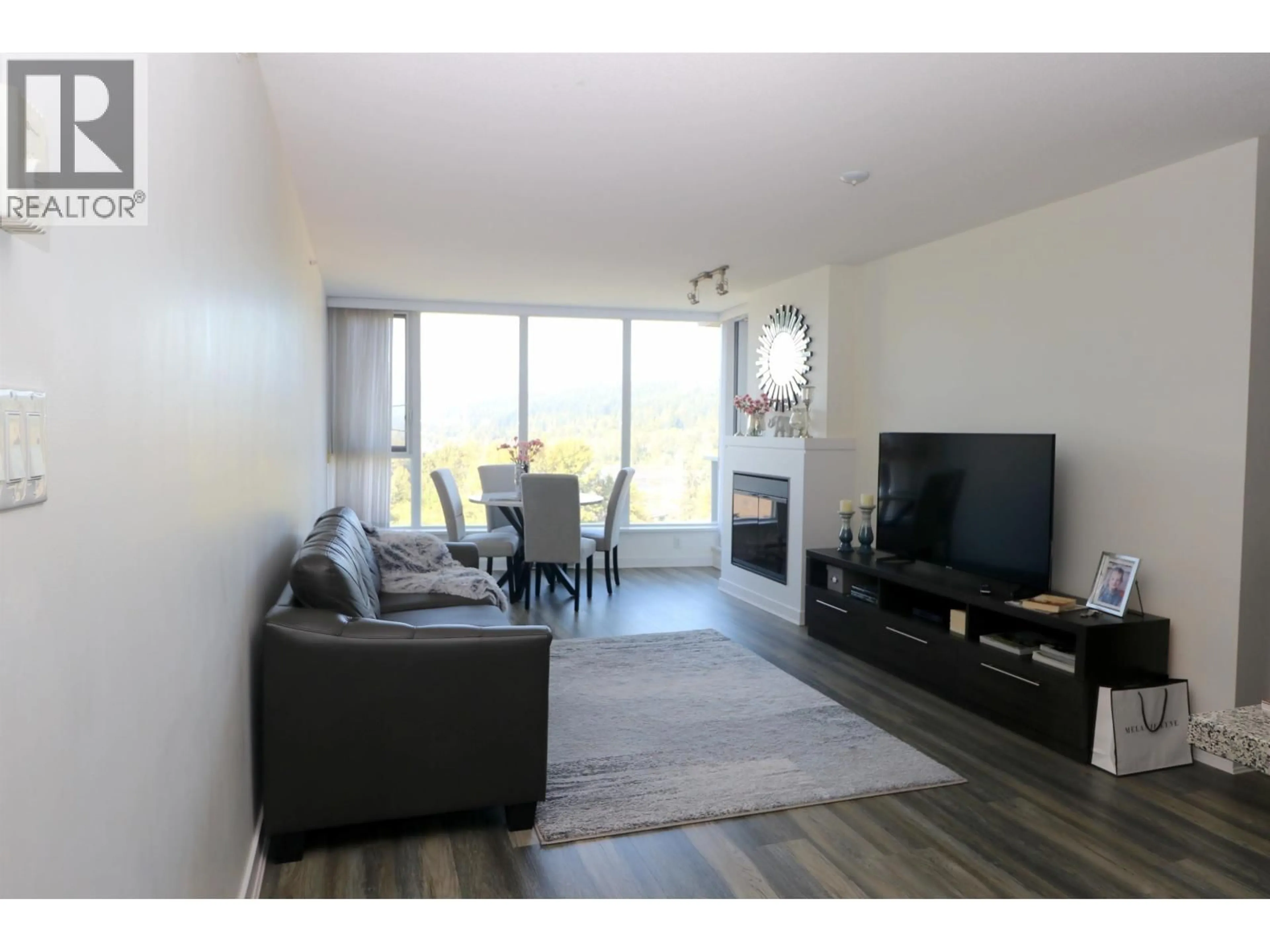 Living room with furniture, wood/laminate floor for 1505 - 660 NOOTKA WAY, Port Moody British Columbia V3H0B7