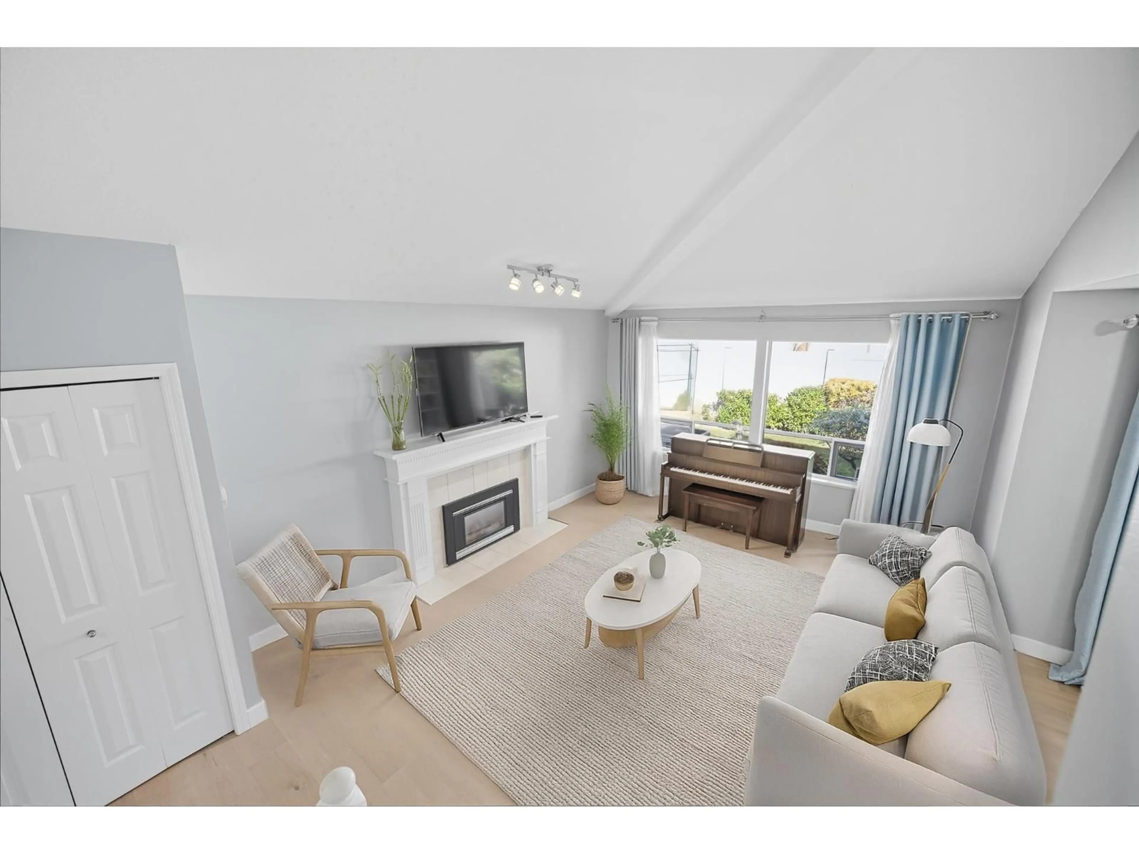 Living room with furniture, wood/laminate floor for 118 - 15121 19, Surrey British Columbia V4A8J5