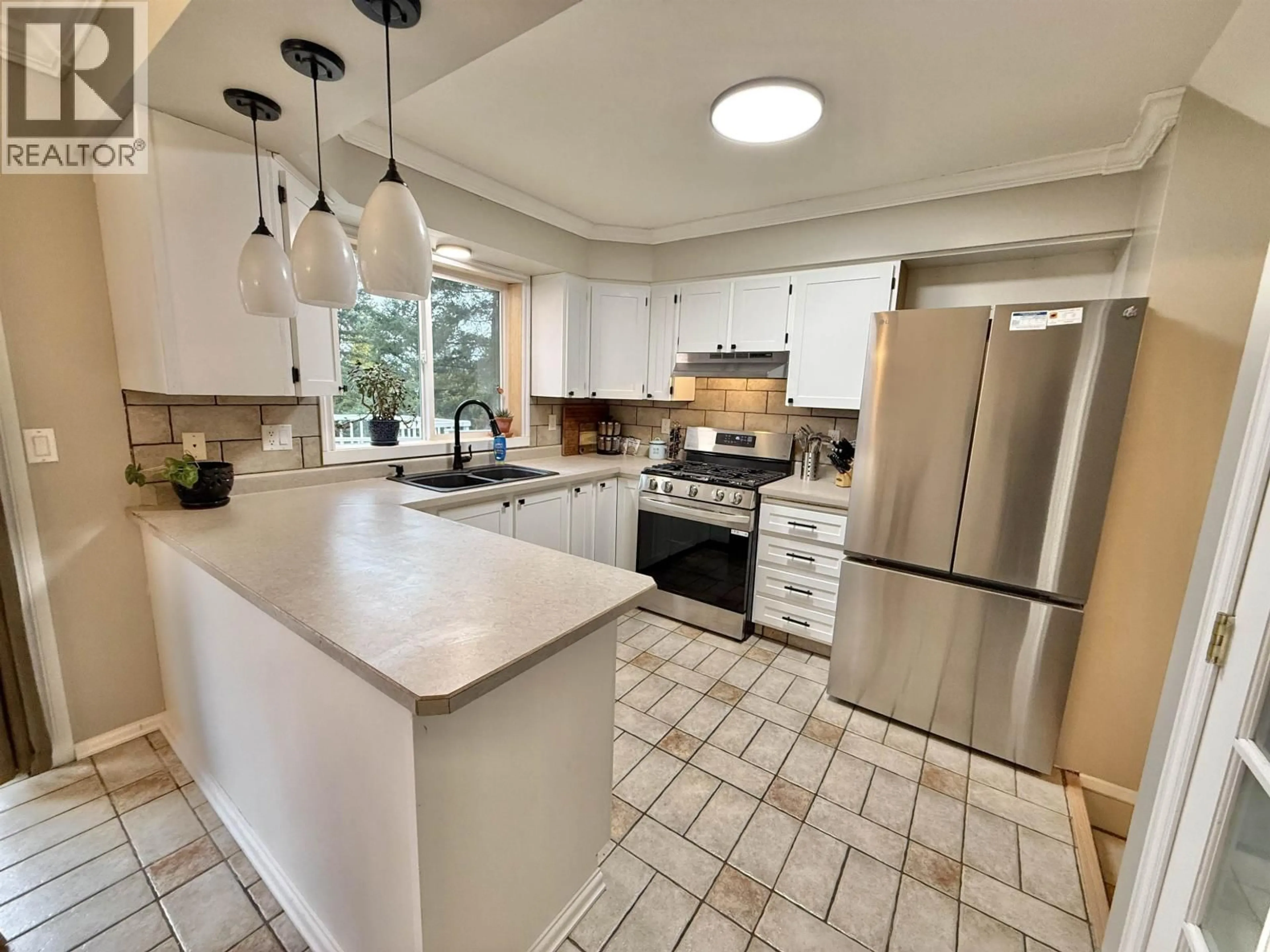 Open concept kitchen, ceramic/tile floor for 2644 FAYETTE ROAD, Quesnel British Columbia V2J6C5