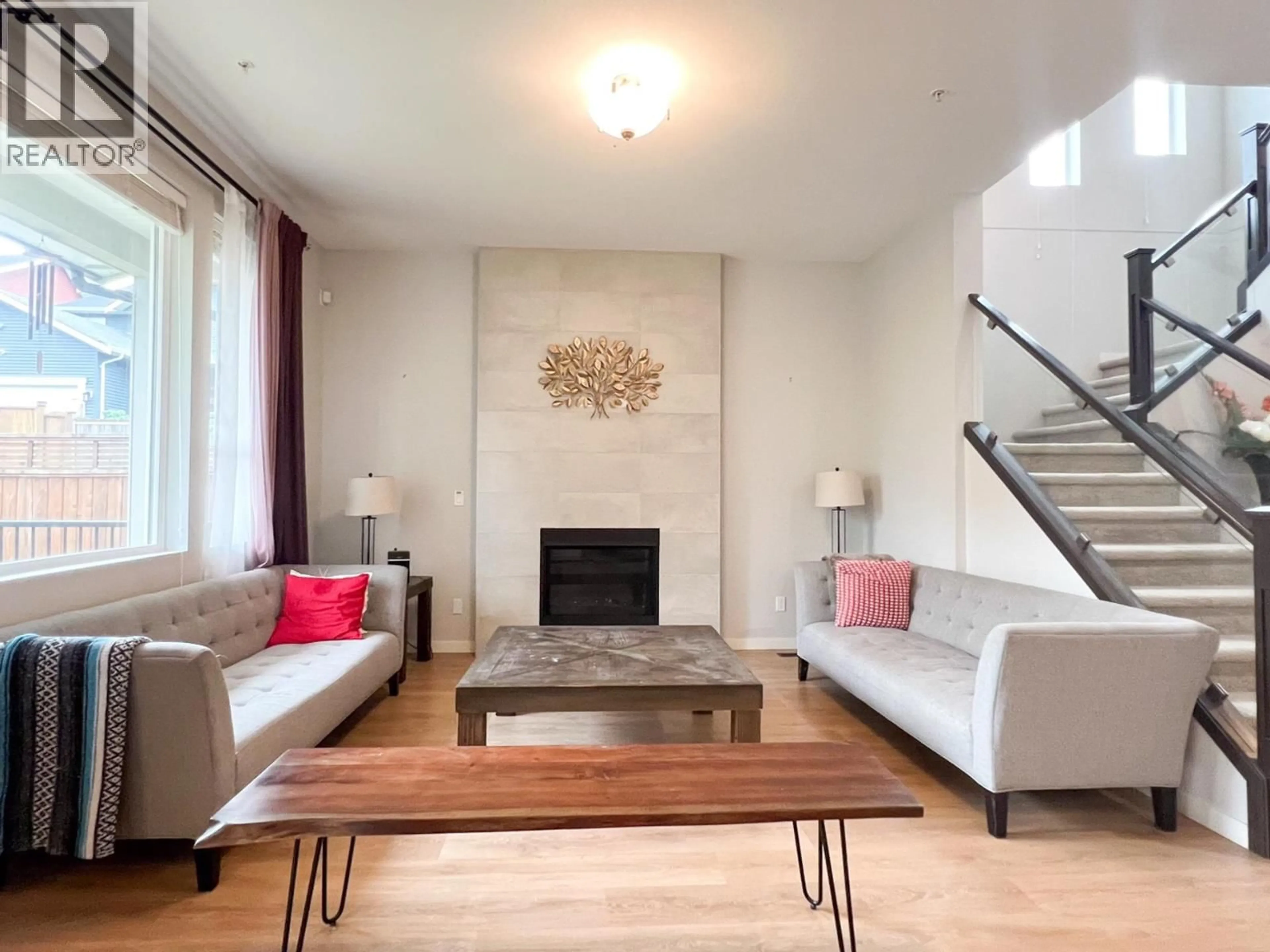 Living room with furniture, wood/laminate floor for 11222 243B STREET, Maple Ridge British Columbia V2W1H5
