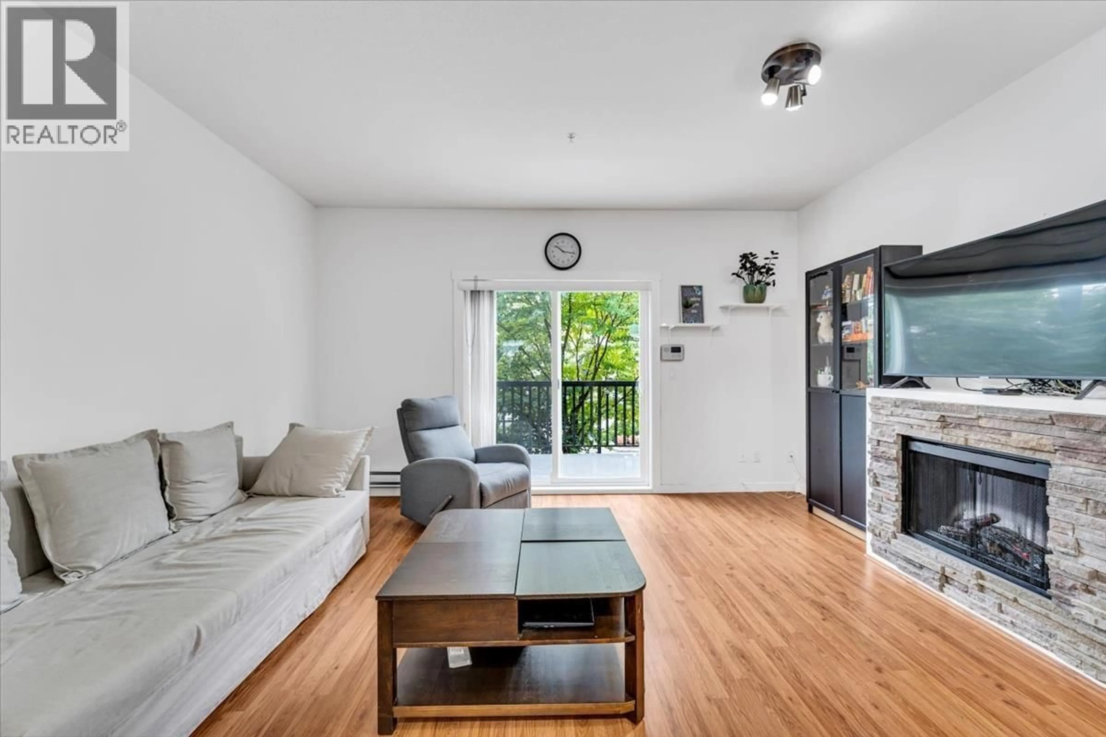 Living room with furniture, wood/laminate floor for 19 - 19572 FRASER WAY, Pitt Meadows British Columbia V3Y0A9