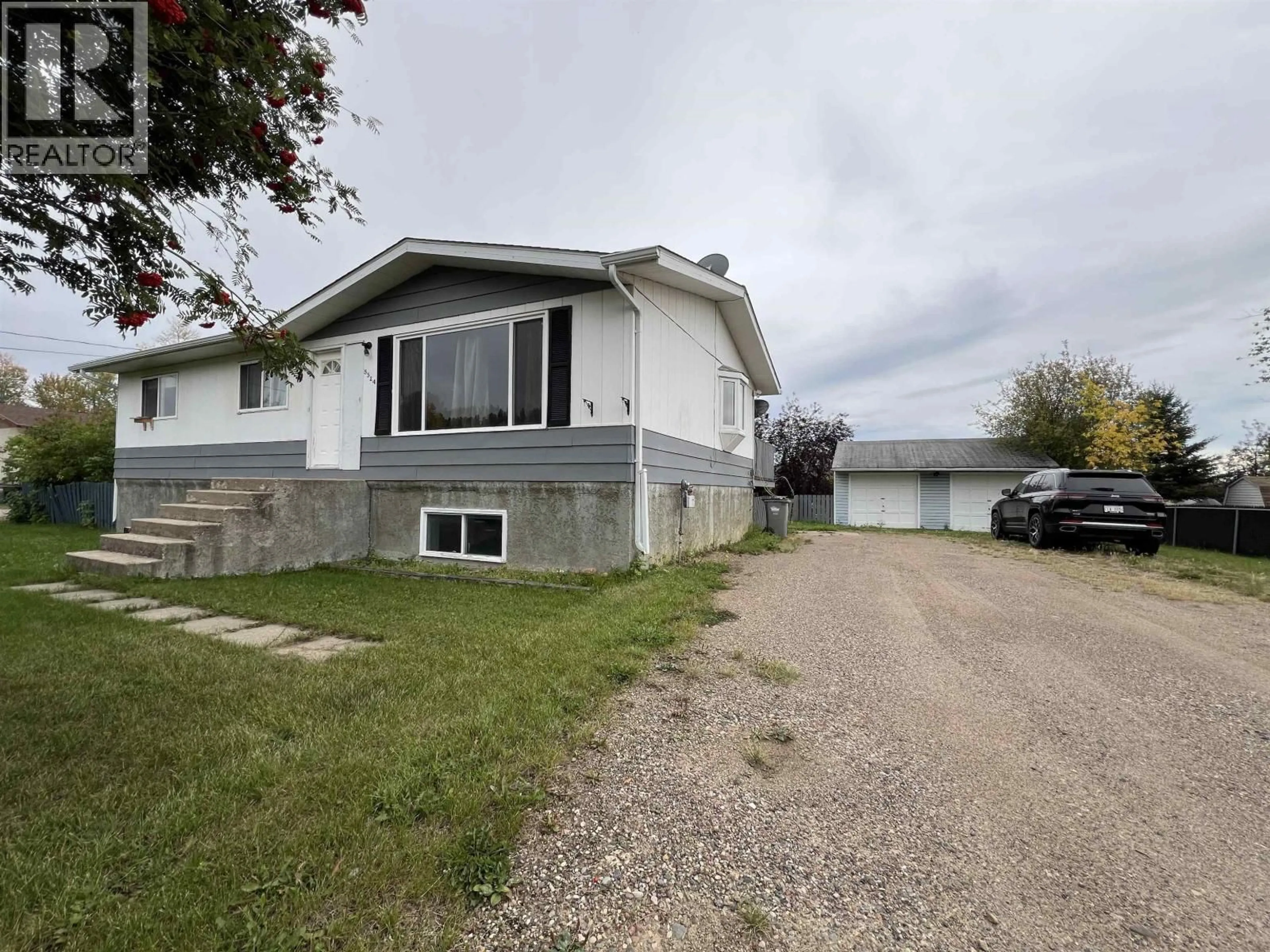 A pic from outside/outdoor area/front of a property/back of a property/a pic from drone, street for 5524 48 STREET, Fort Nelson British Columbia V0C1R0