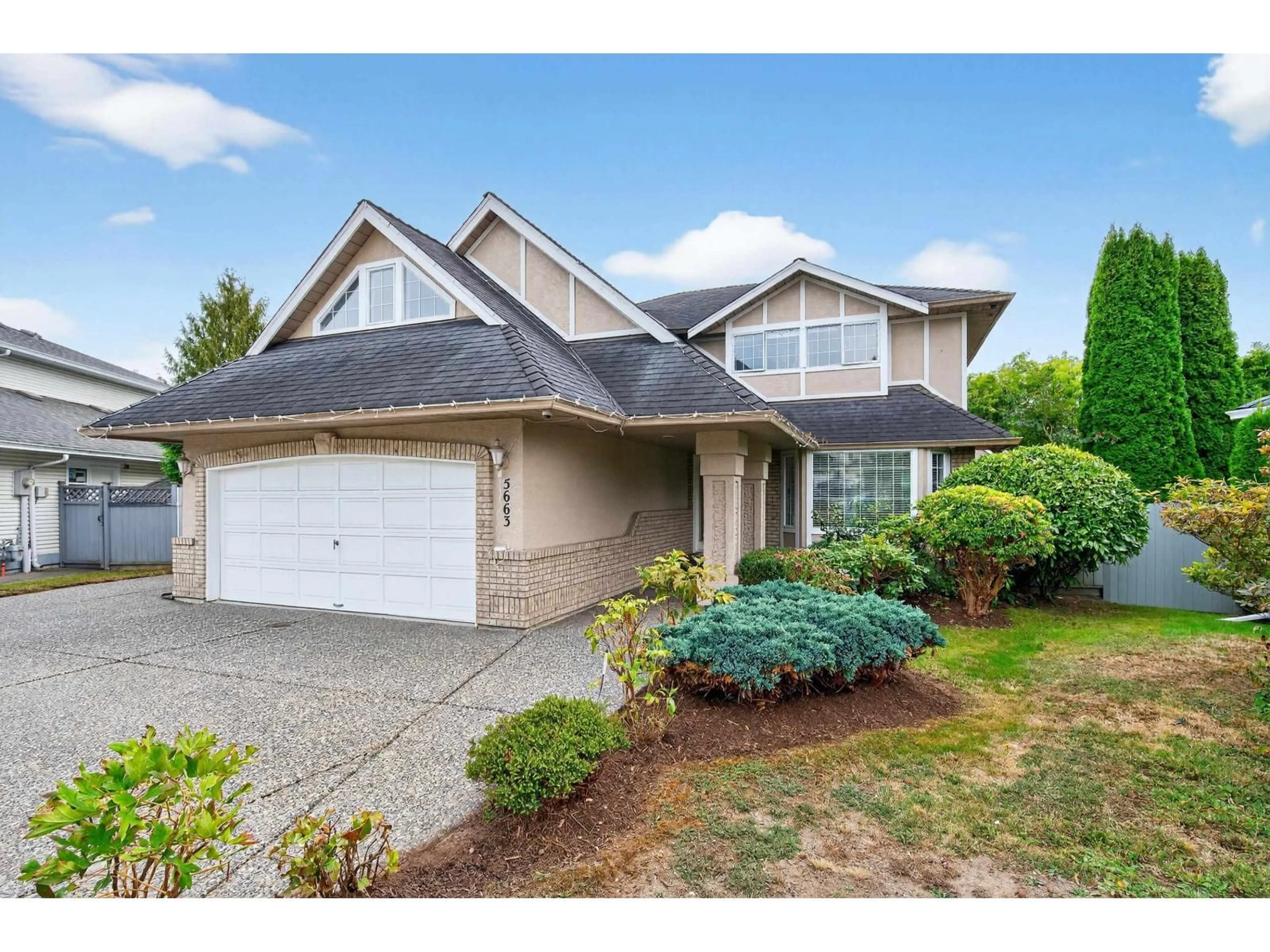 Home with vinyl exterior material, street for 5663 186A, Surrey British Columbia V3S7N2