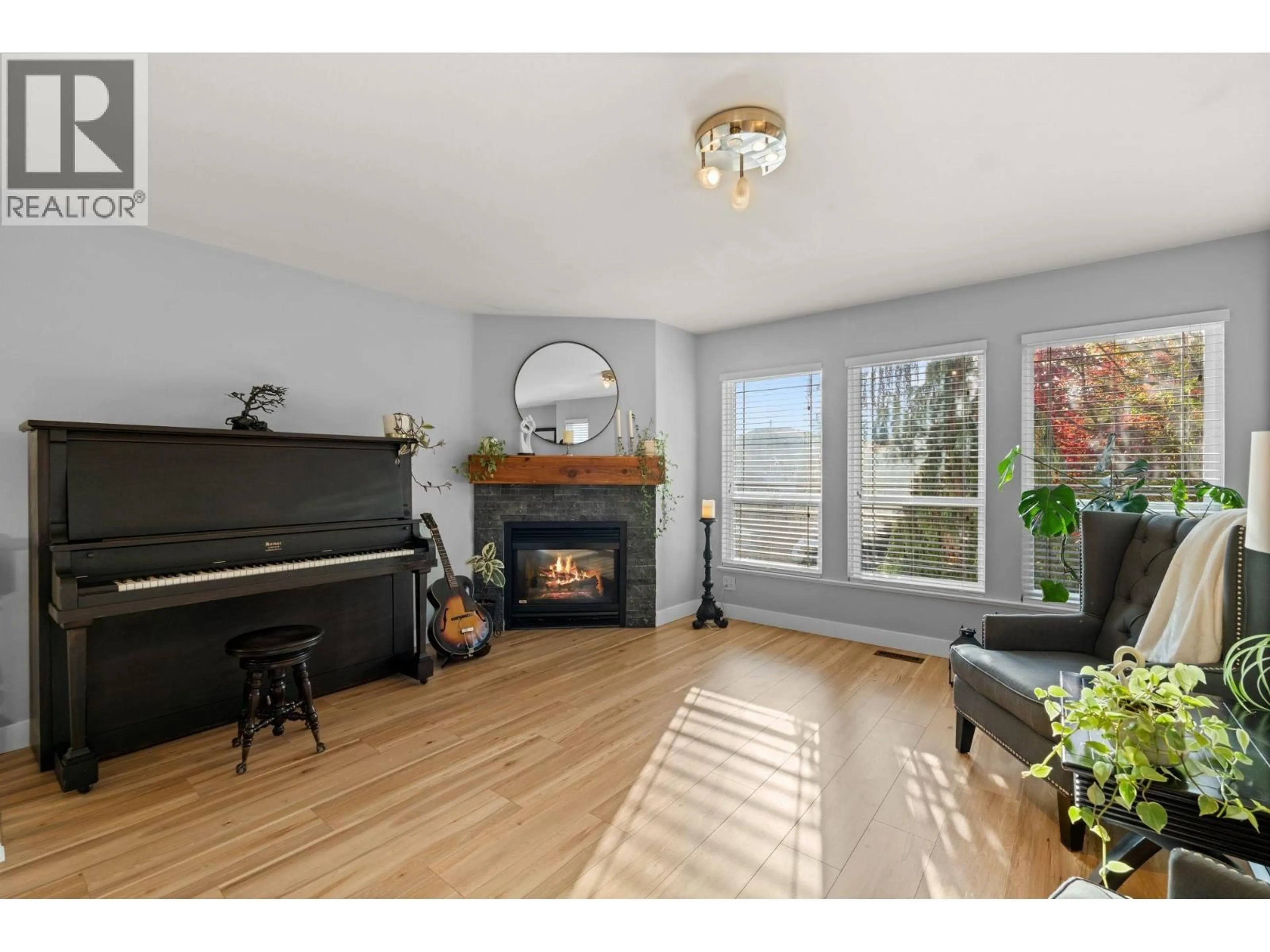 Living room with furniture, wood/laminate floor for 11970 249A STREET, Maple Ridge British Columbia V4R2E3