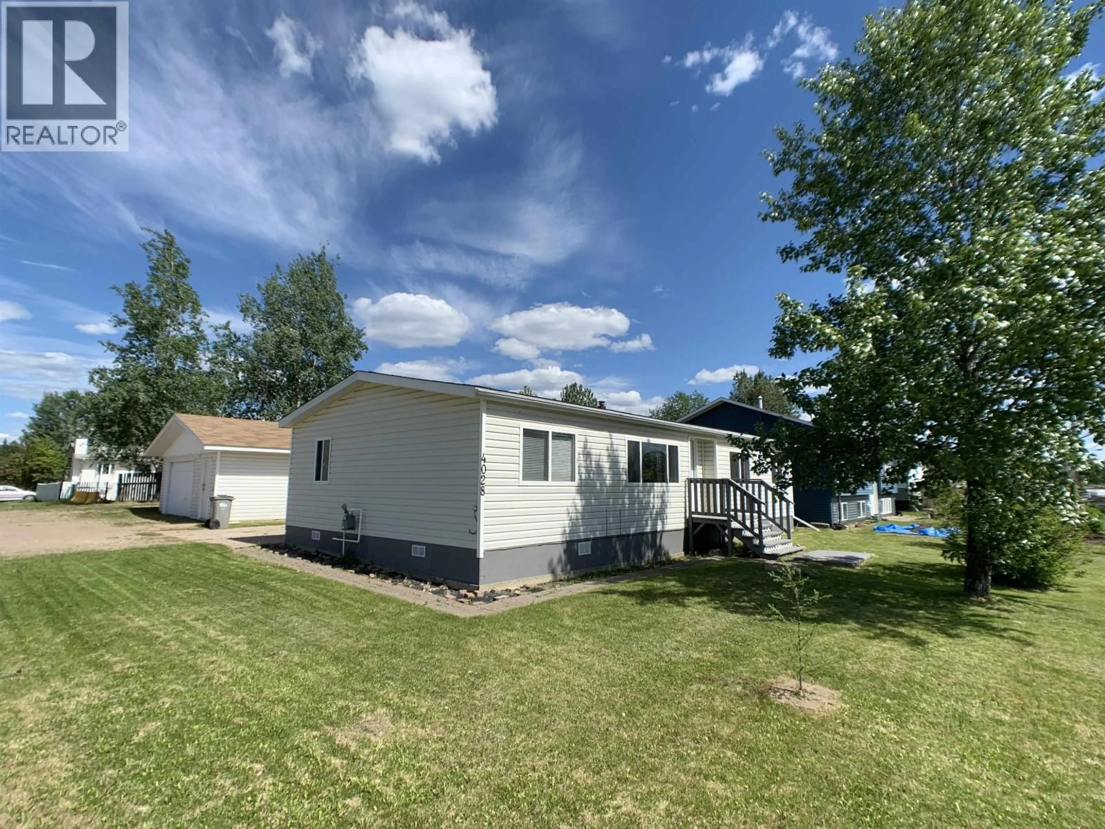 A pic from outside/outdoor area/front of a property/back of a property/a pic from drone, water/lake/river/ocean view for 4028 POPLAR AVENUE, Fort Nelson British Columbia V0C1R0