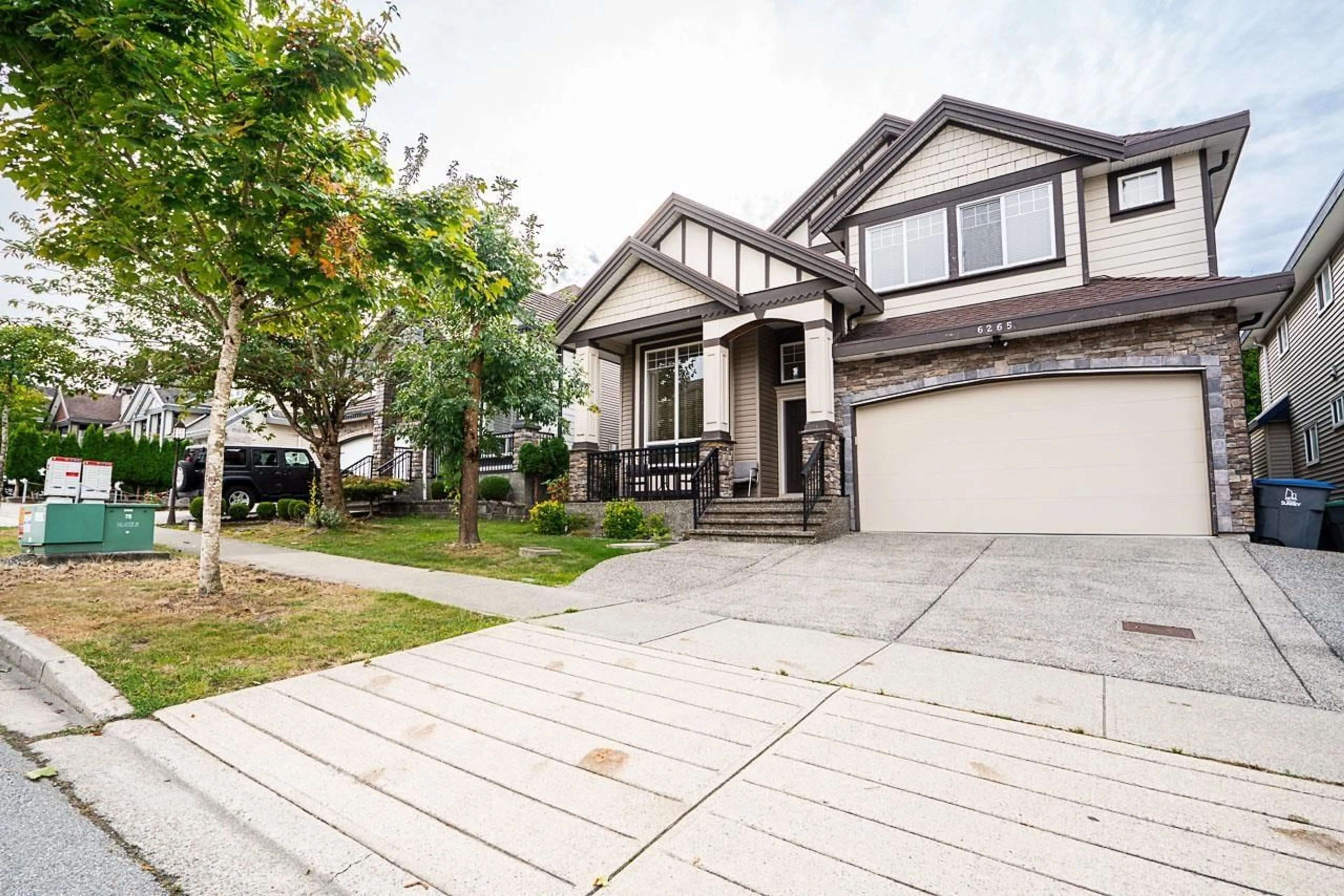 Home with vinyl exterior material, street for 6265 141A, Surrey British Columbia V3X0B2
