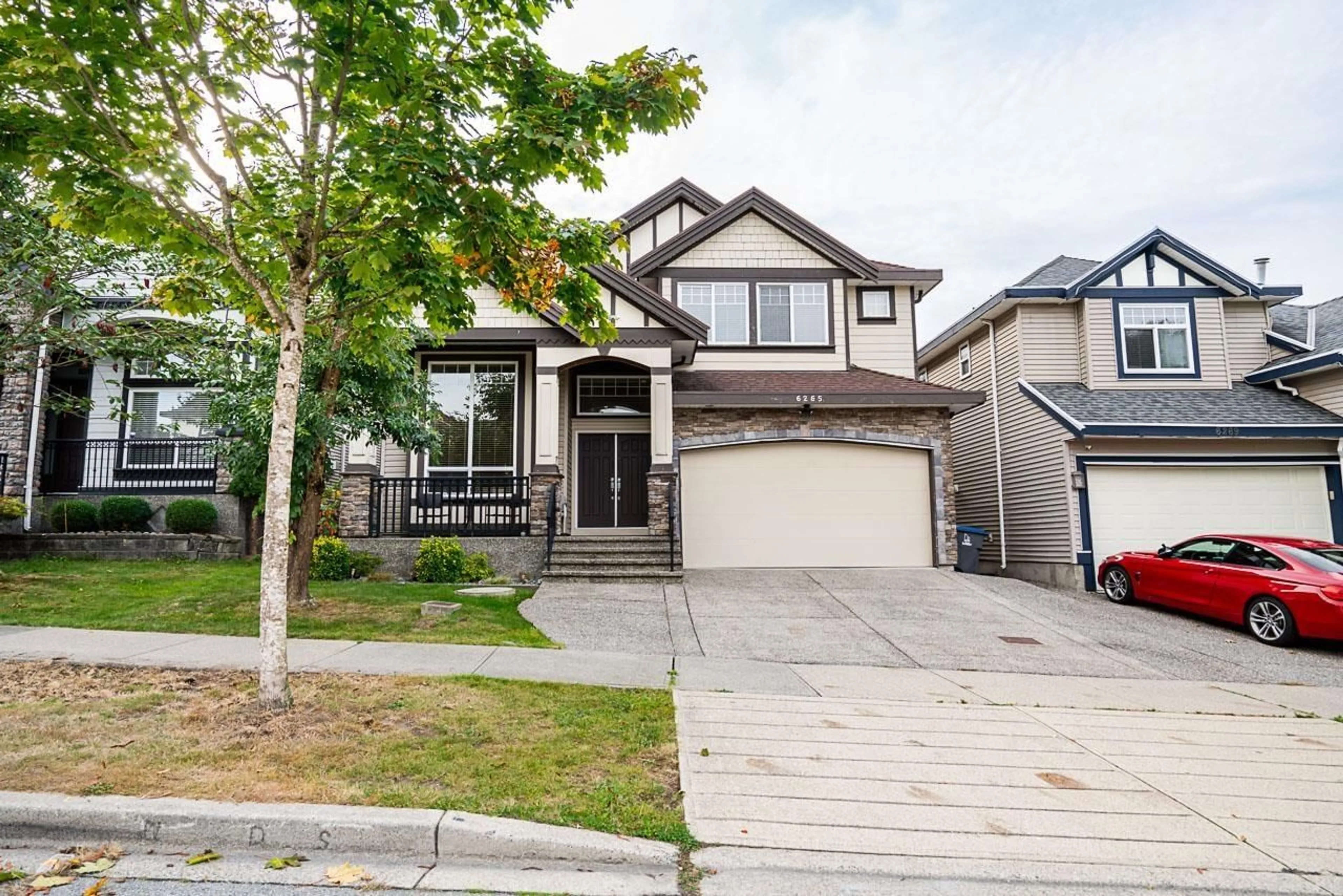 Home with vinyl exterior material, street for 6265 141A, Surrey British Columbia V3X0B2