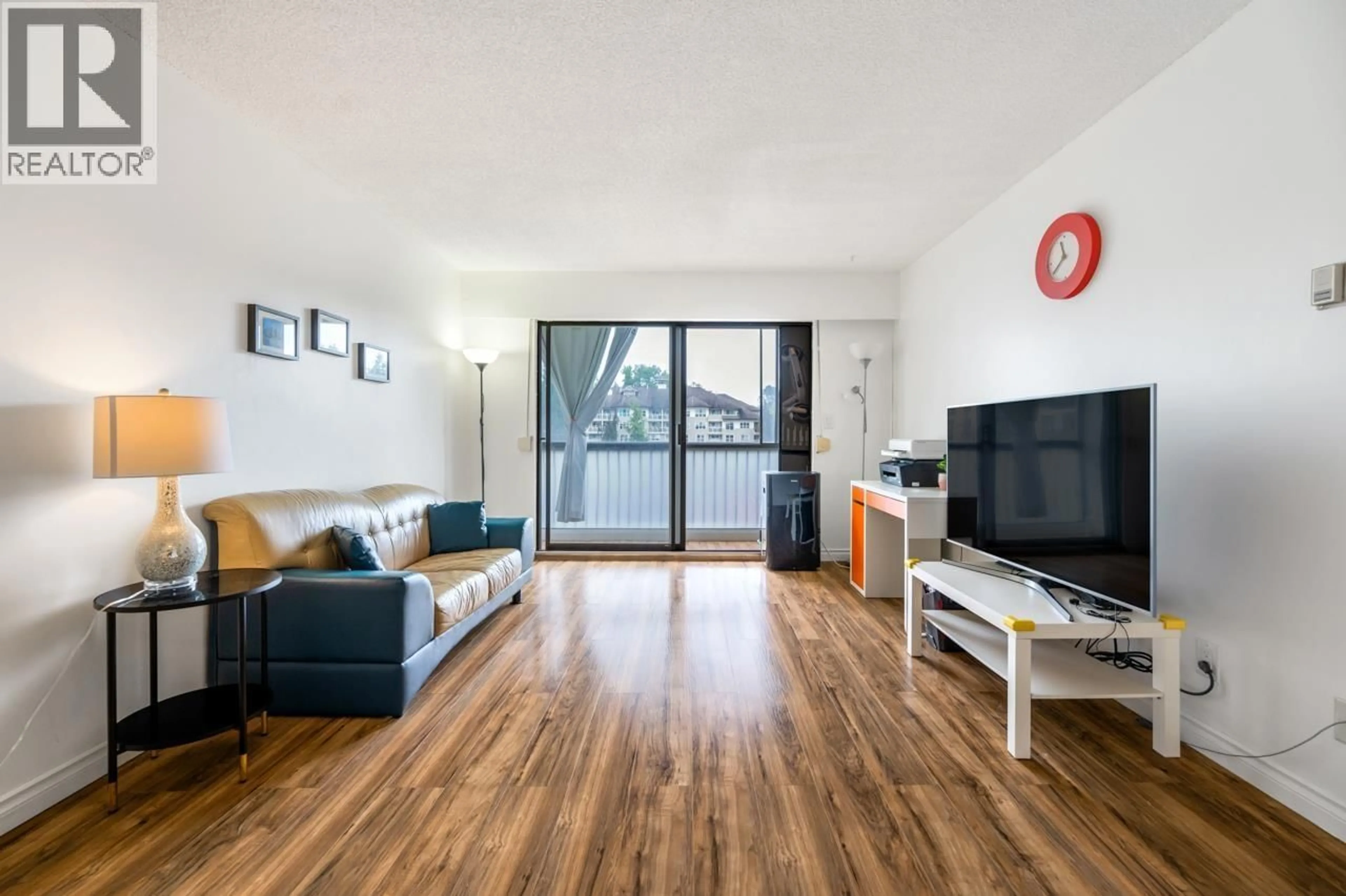 Living room with furniture, wood/laminate floor for 203 - 2425 SHAUGHNESSY STREET, Port Coquitlam British Columbia V3C3E6