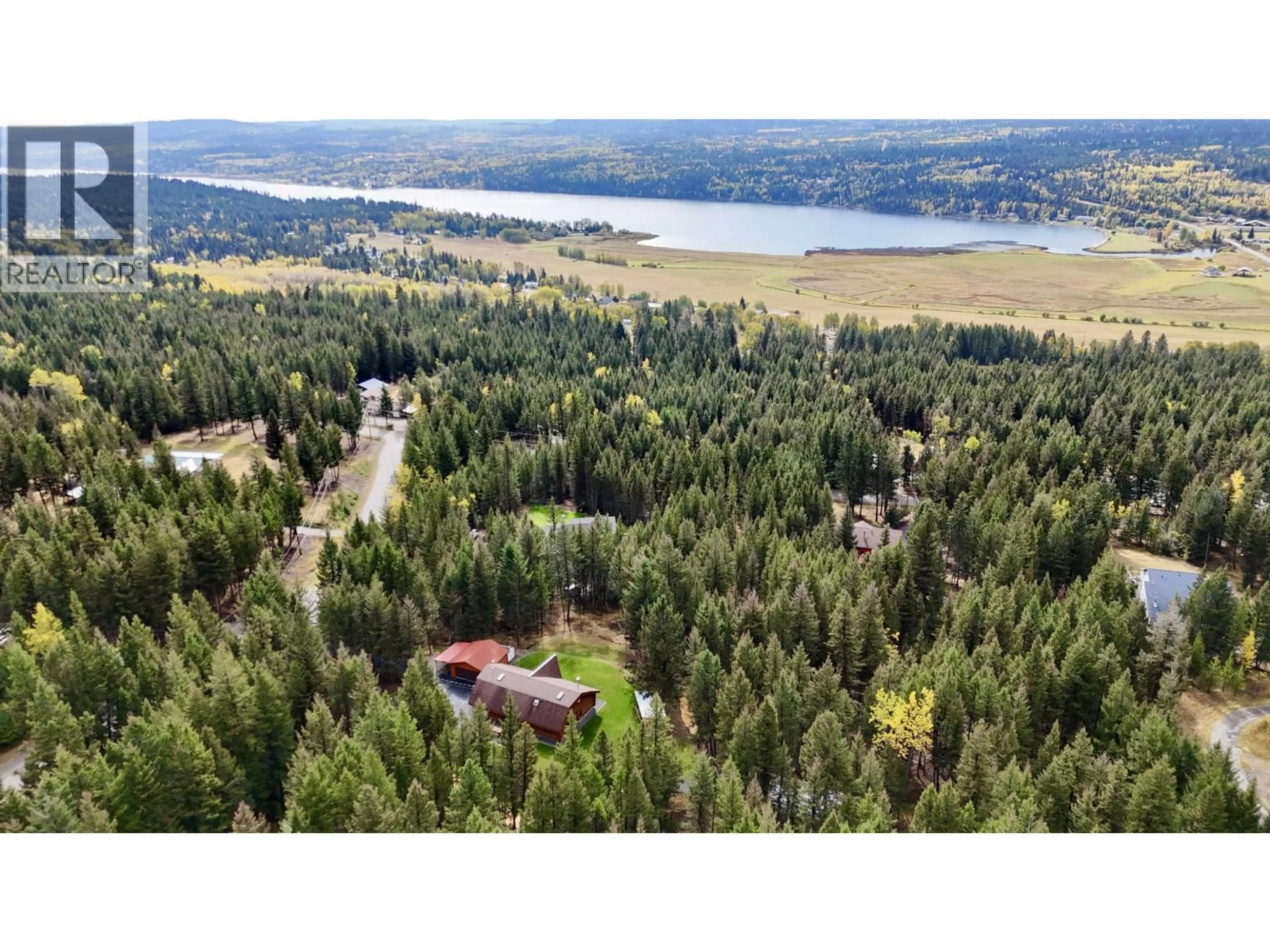 A pic from outside/outdoor area/front of a property/back of a property/a pic from drone, forest/trees view for 6300 GARY ROAD, Horse Lake British Columbia V0K2E3