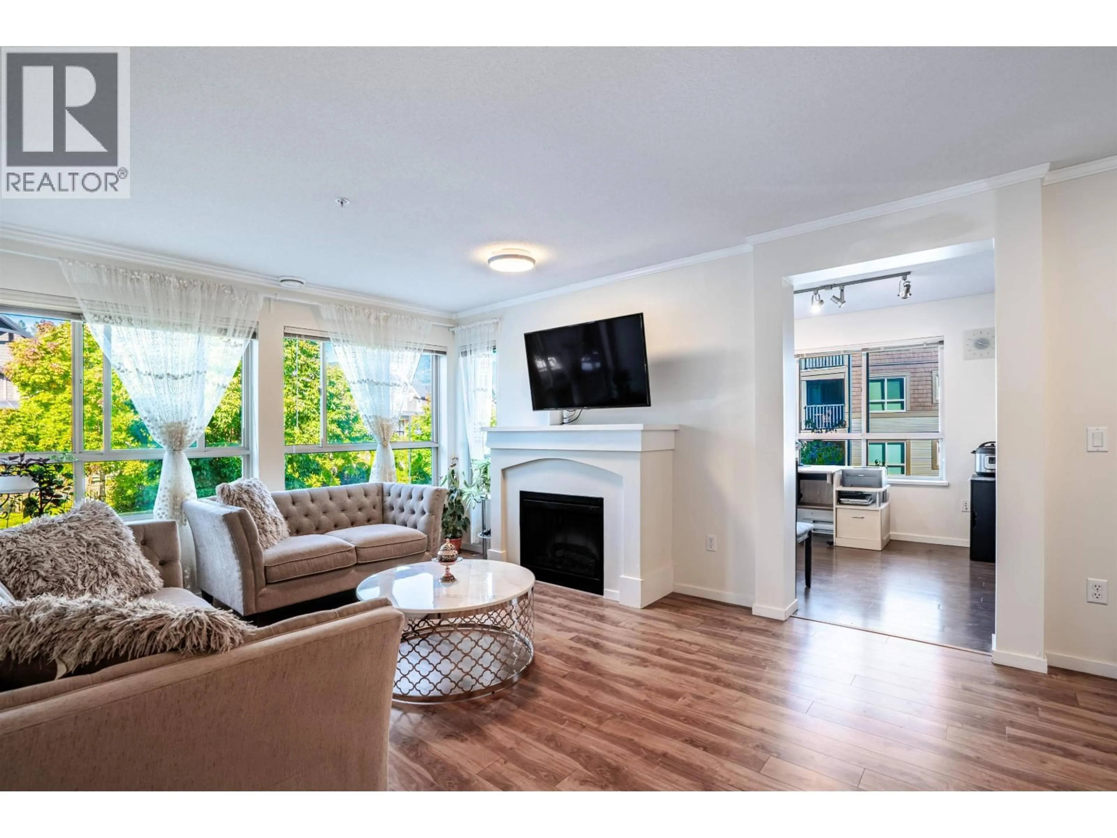 Living room with furniture, wood/laminate floor for 303 - 3110 DAYANEE SPRINGS BOULEVARD, Coquitlam British Columbia V3E0B4