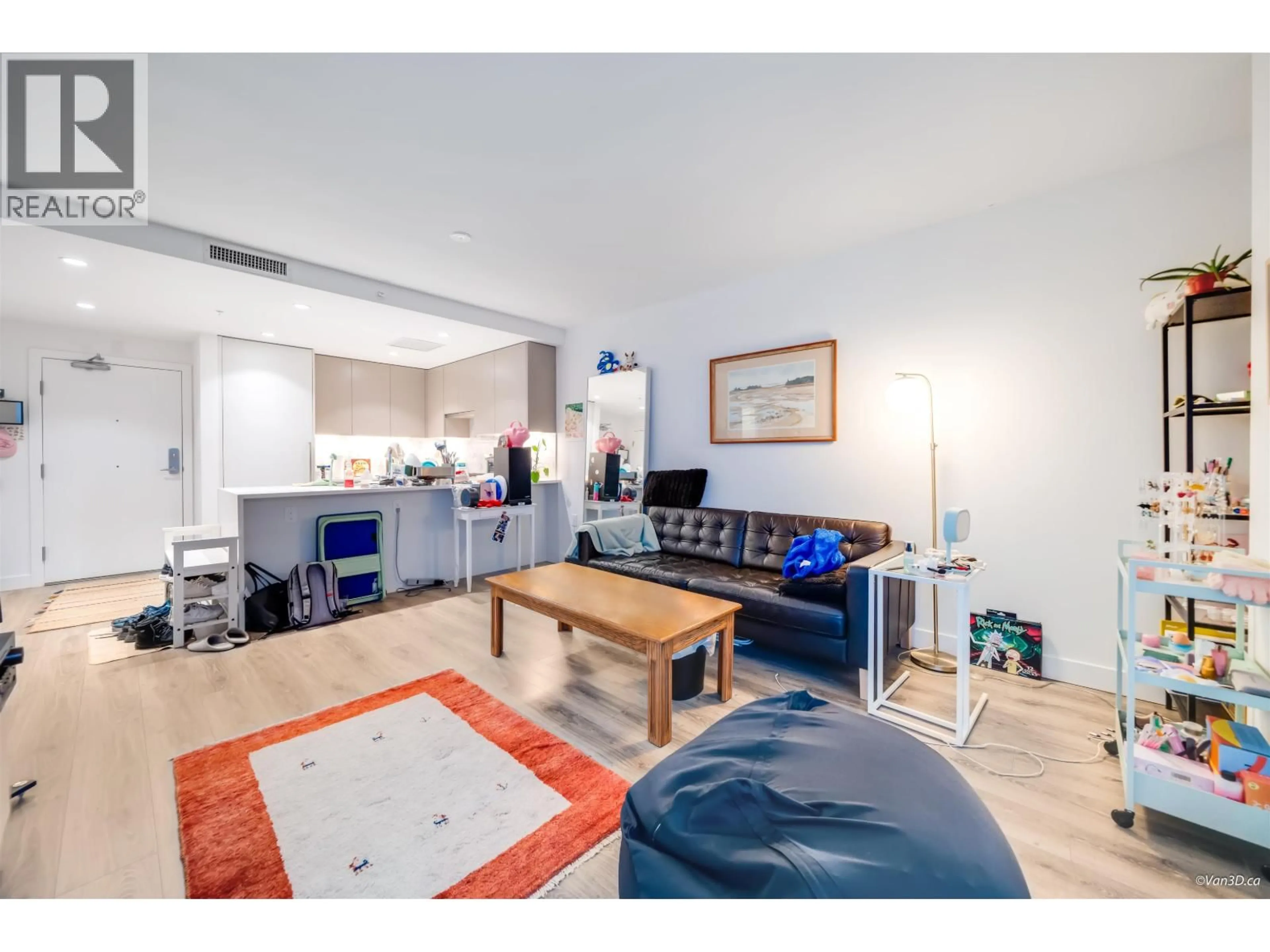 Living room with furniture, wood/laminate floor for 1108 - 8181 CHESTER STREET, Vancouver British Columbia V5X0J9