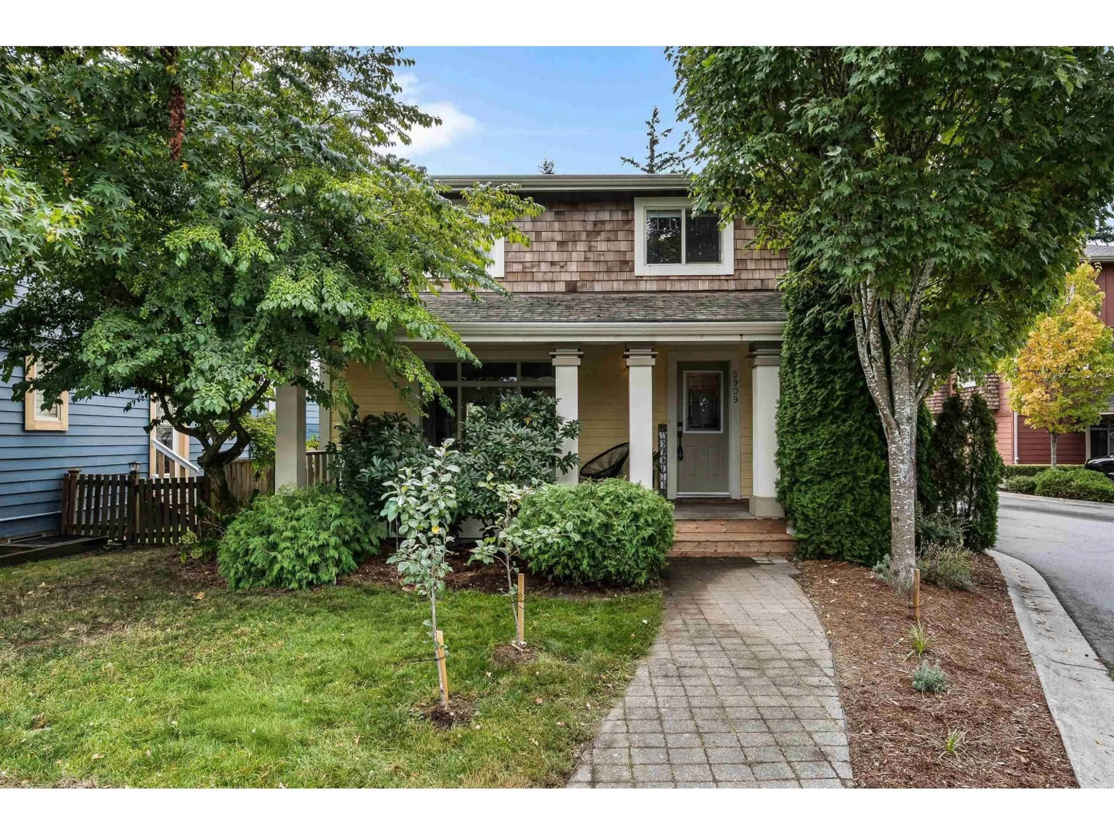 Home with brick exterior material, street for 5909 COWICHAN STREET, Chilliwack British Columbia V2R0G8