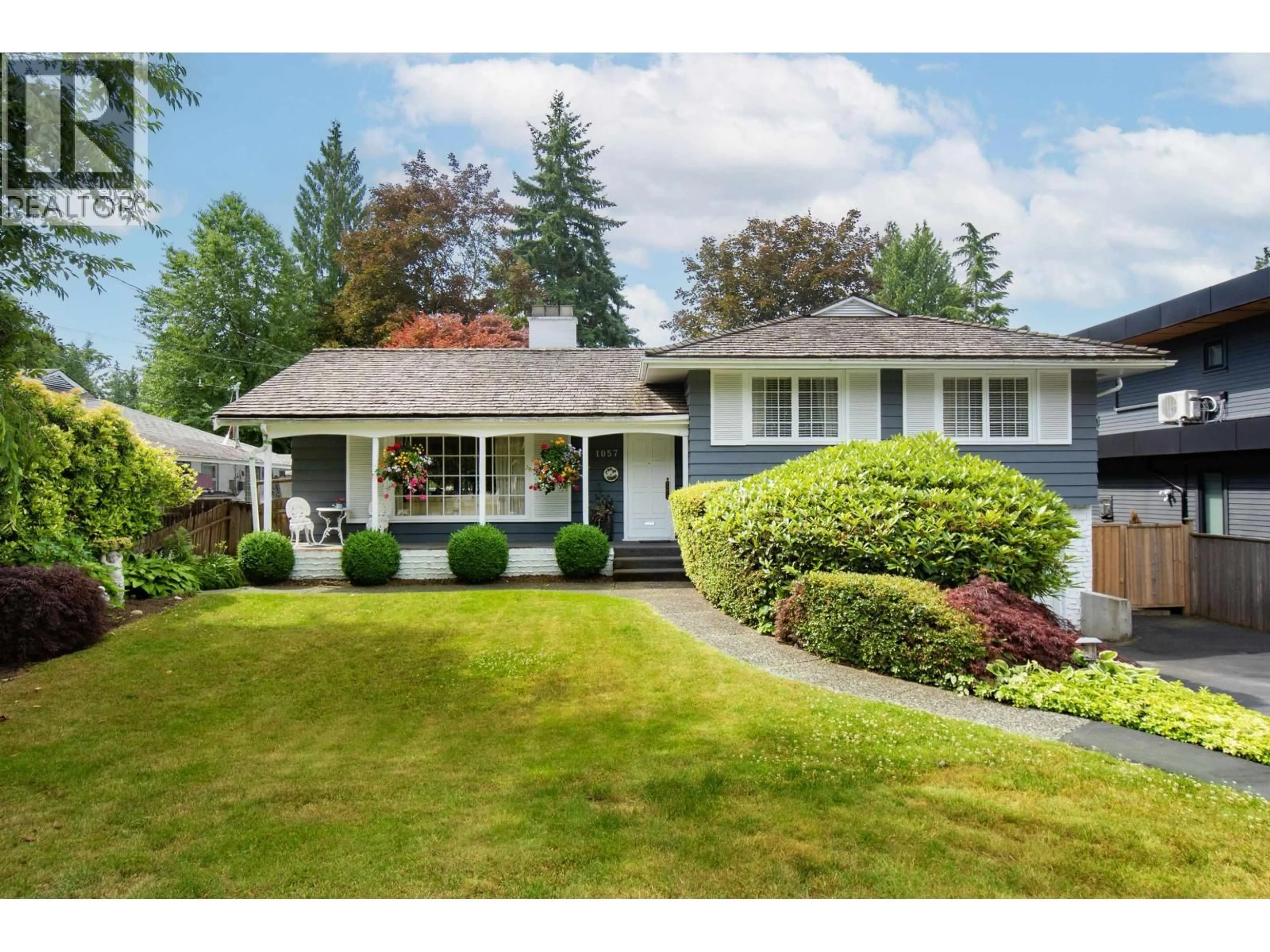 Home with vinyl exterior material, street for 1057 MONTROYAL BOULEVARD, North Vancouver British Columbia V7R2H5