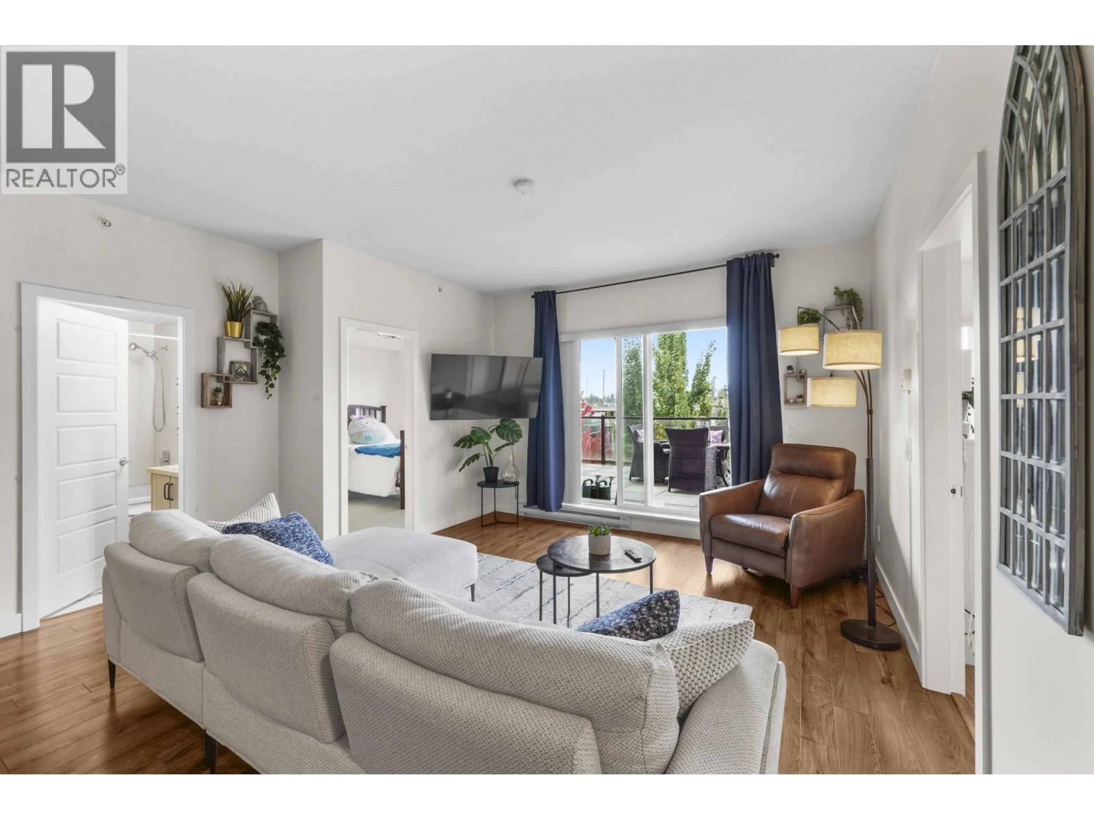 Living room with furniture, wood/laminate floor for 404 - 12070 227 STREET, Maple Ridge British Columbia V2X9H2