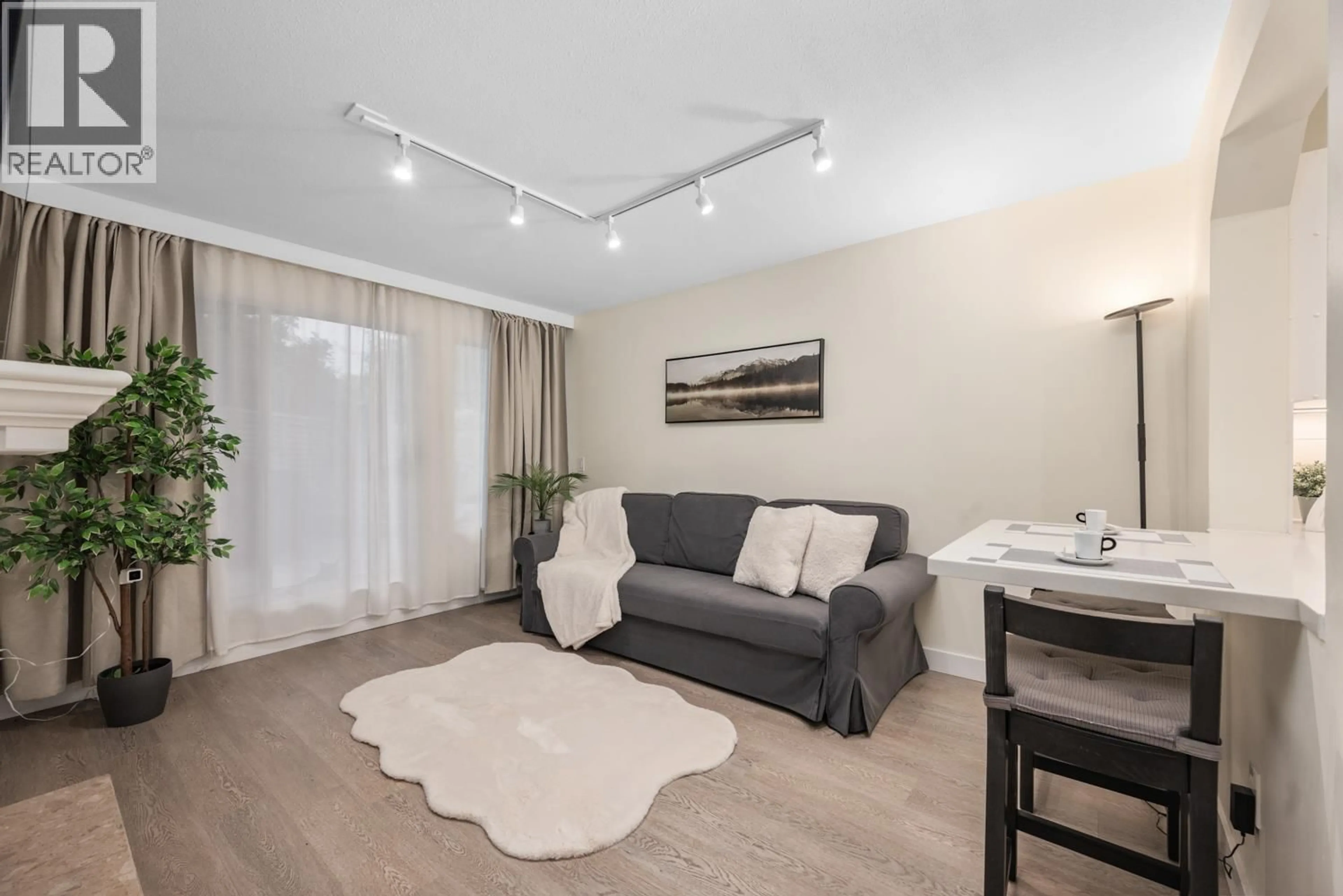 Living room with furniture, wood/laminate floor for 114 - 3770 MANOR STREET, Burnaby British Columbia V5G4T5