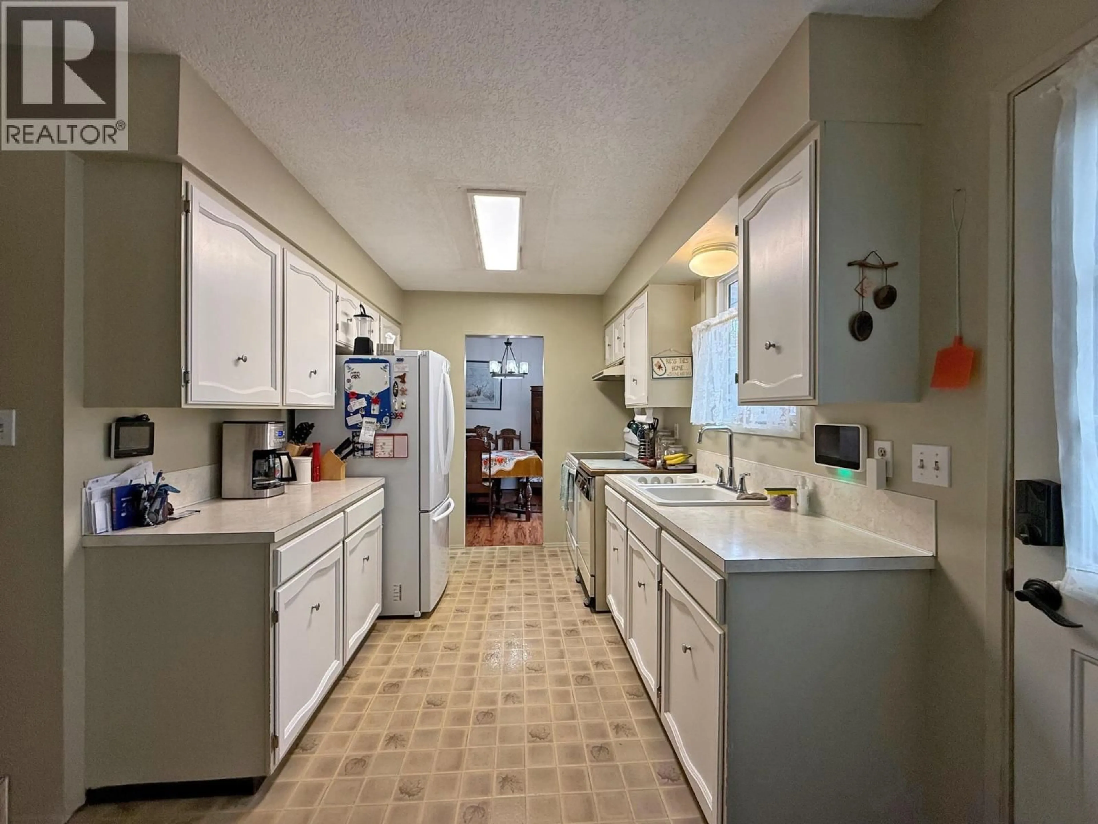 Kitchen with laundary machines, ceramic/tile floor for 1235 PIGEON AVENUE, Williams Lake British Columbia V2G2C3