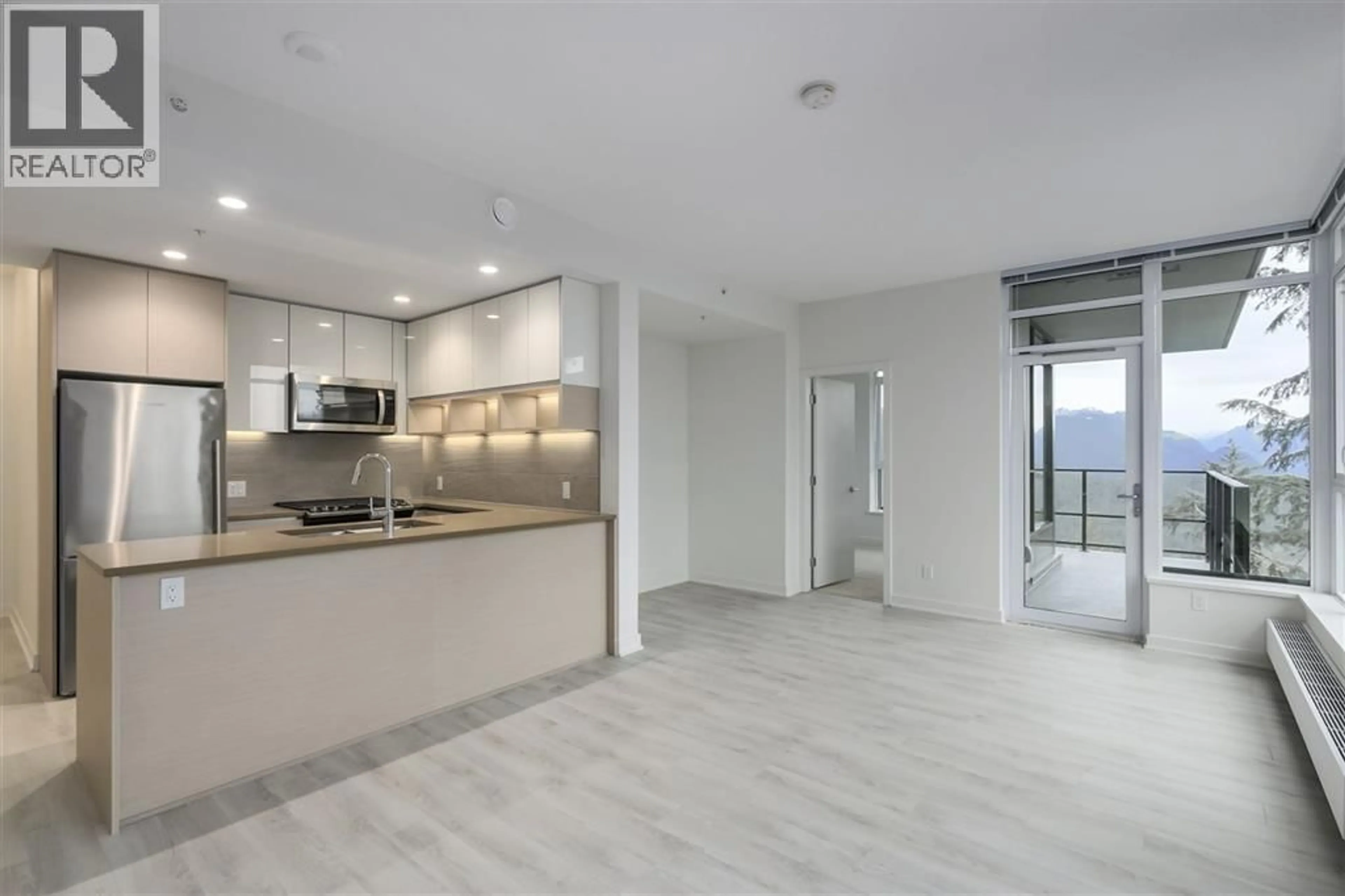Open concept kitchen, ceramic/tile floor for 303 - 8850 UNIVERSITY CRESCENT, Burnaby British Columbia V5A4Y8