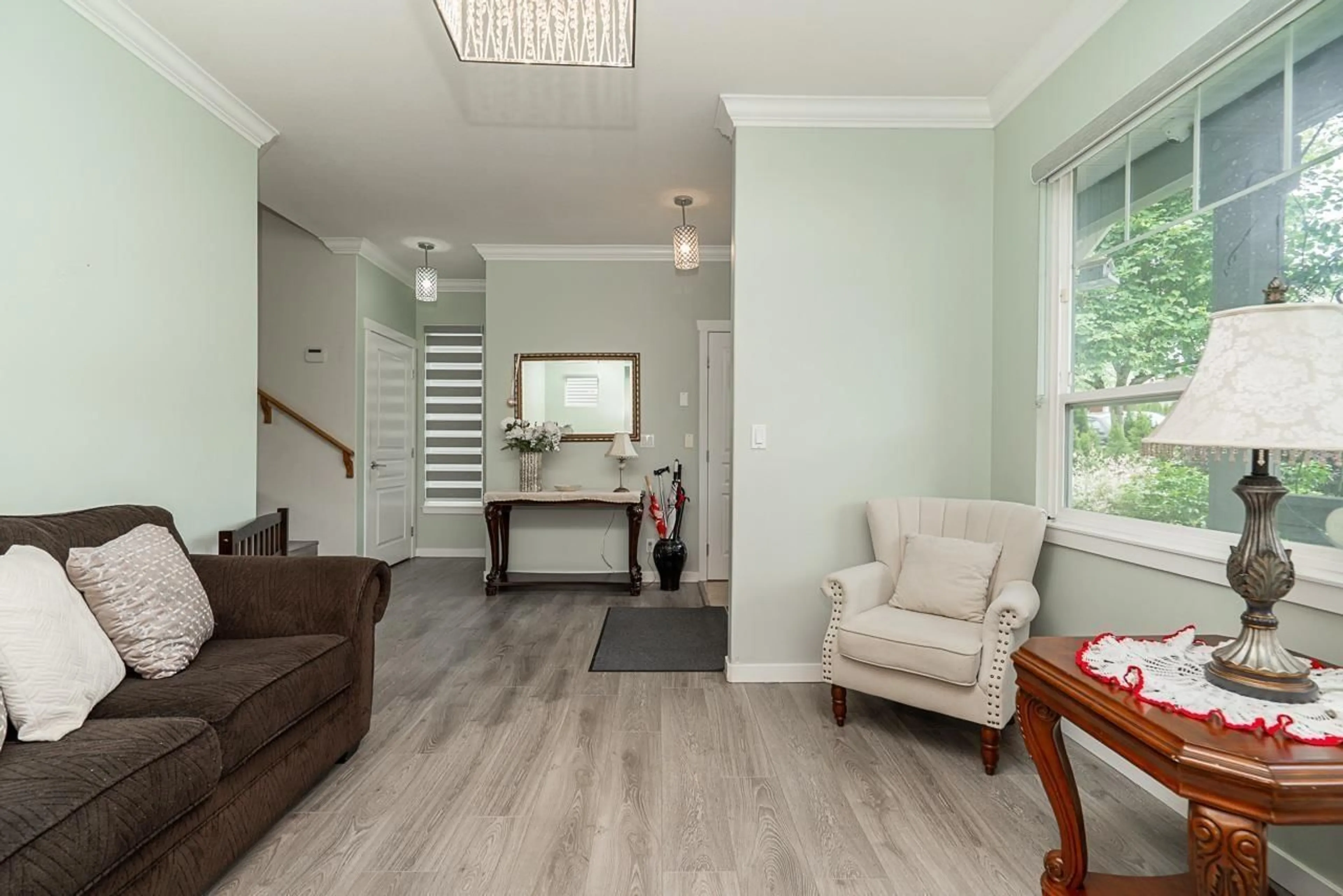Living room with furniture, wood/laminate floor for 14858 56A, Surrey British Columbia V3S8X1