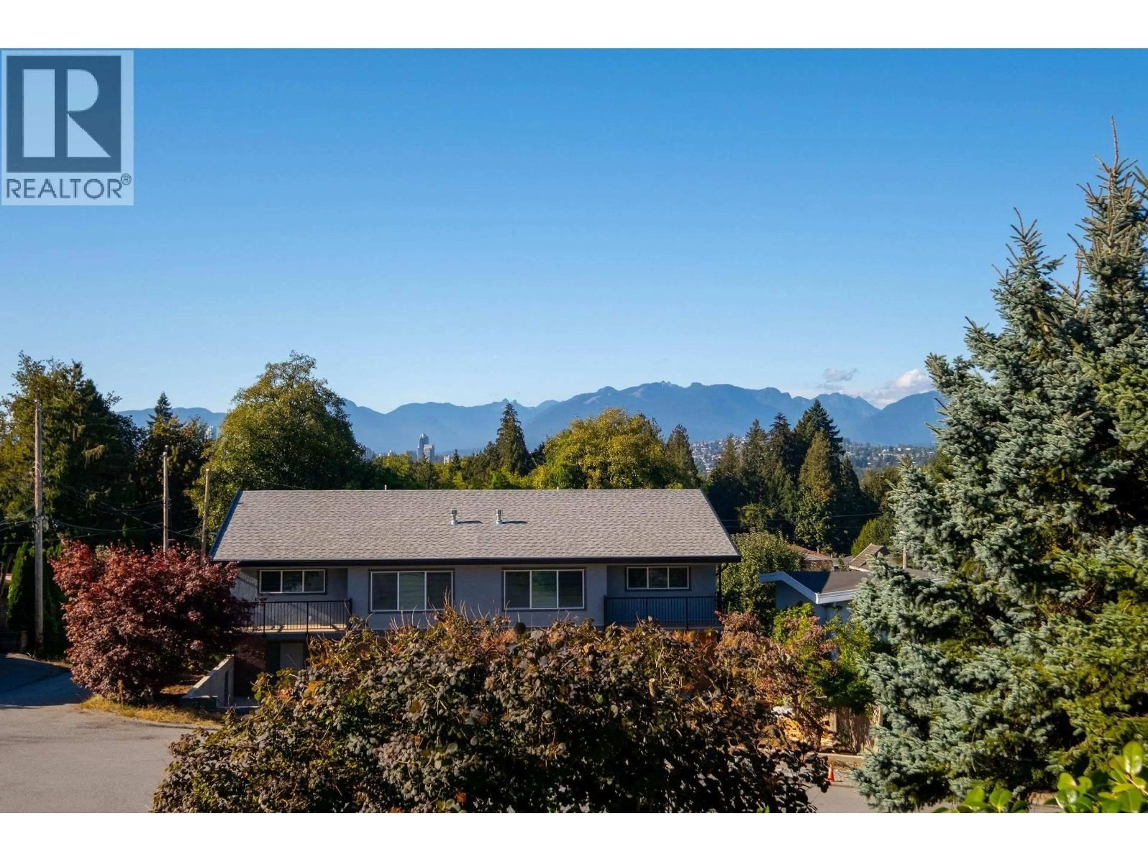 A pic from outside/outdoor area/front of a property/back of a property/a pic from drone, mountain view for 7740 ALLMAN STREET, Burnaby British Columbia V5E2B1