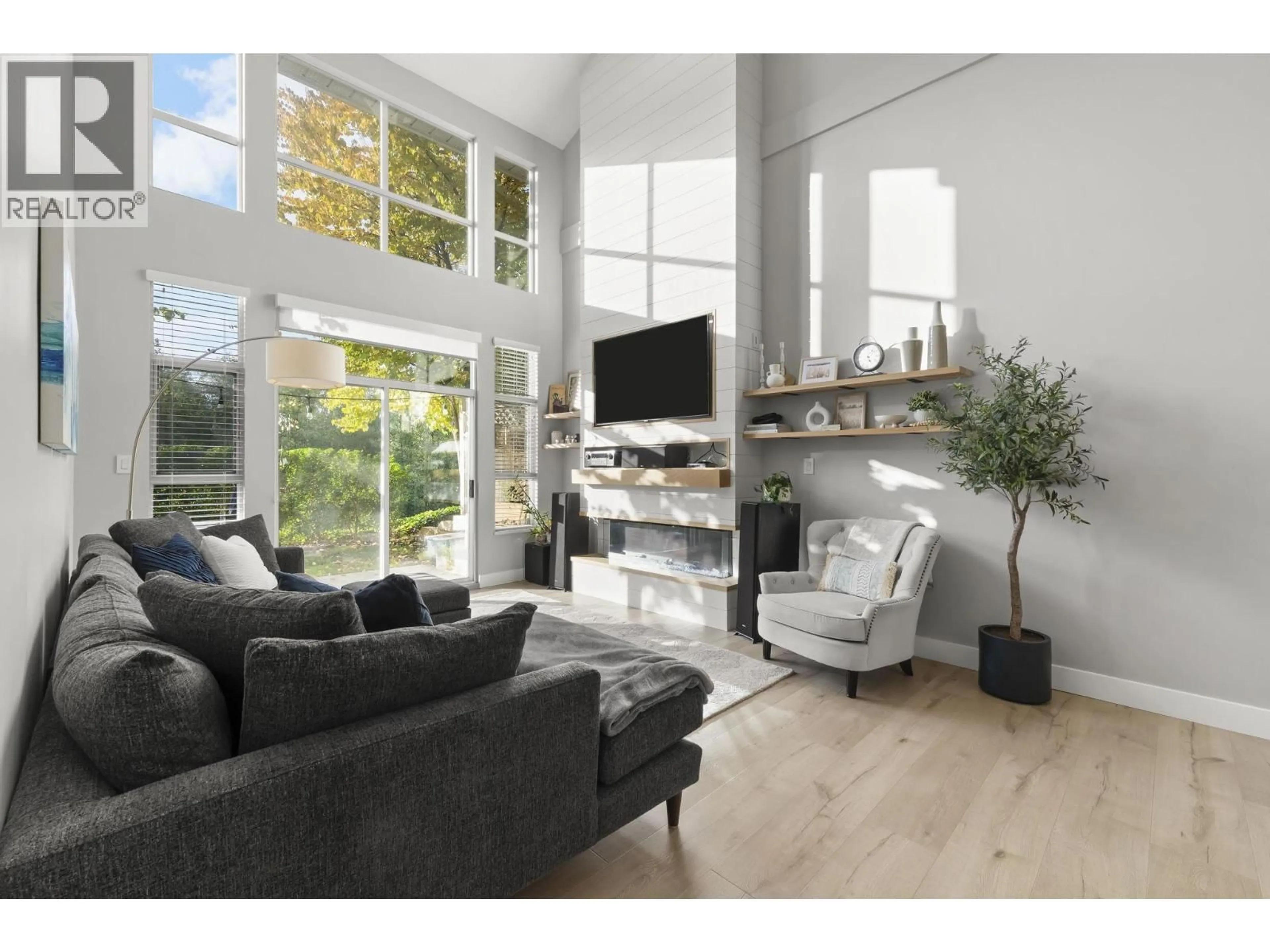 Living room with furniture, wood/laminate floor for 1161 O'FLAHERTY GATE, Port Coquitlam British Columbia V3C6H2