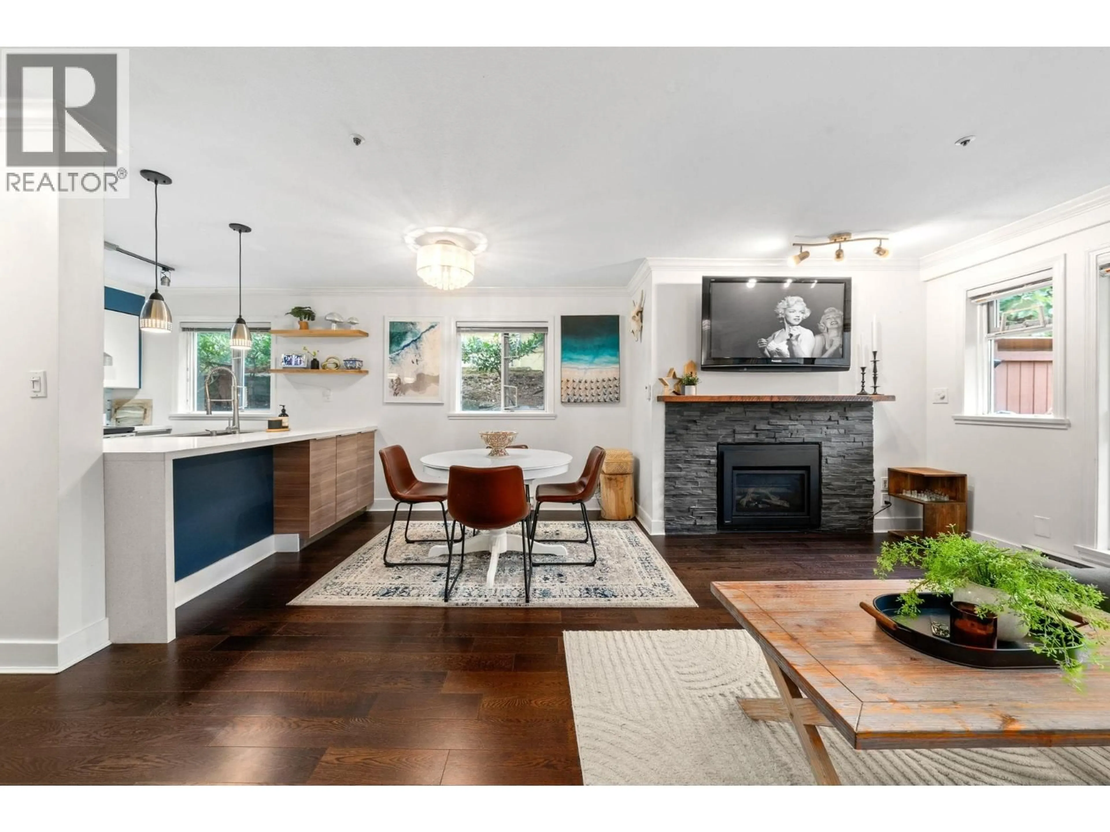 Open concept kitchen, wood/laminate floor for 101 - 2215 MCGILL STREET, Vancouver British Columbia V5L1C3