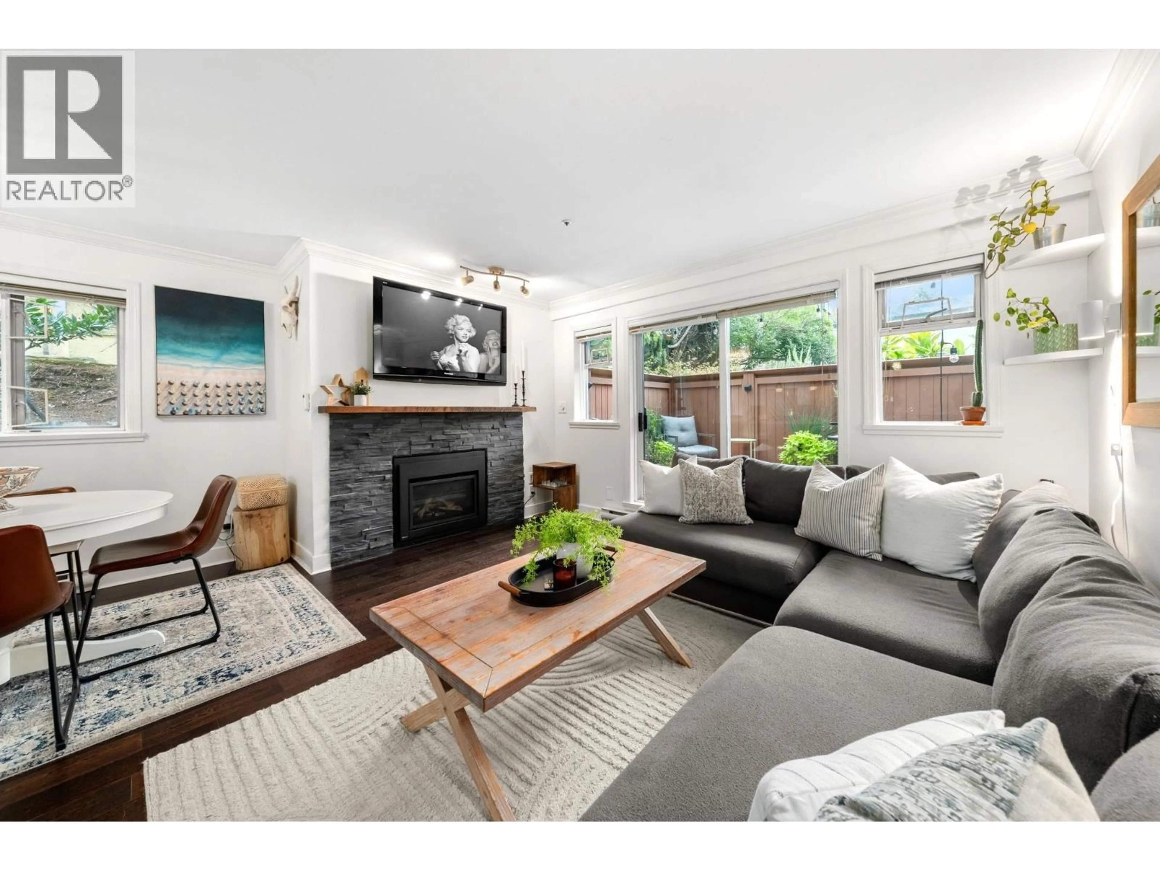 Living room with furniture, wood/laminate floor for 101 - 2215 MCGILL STREET, Vancouver British Columbia V5L1C3