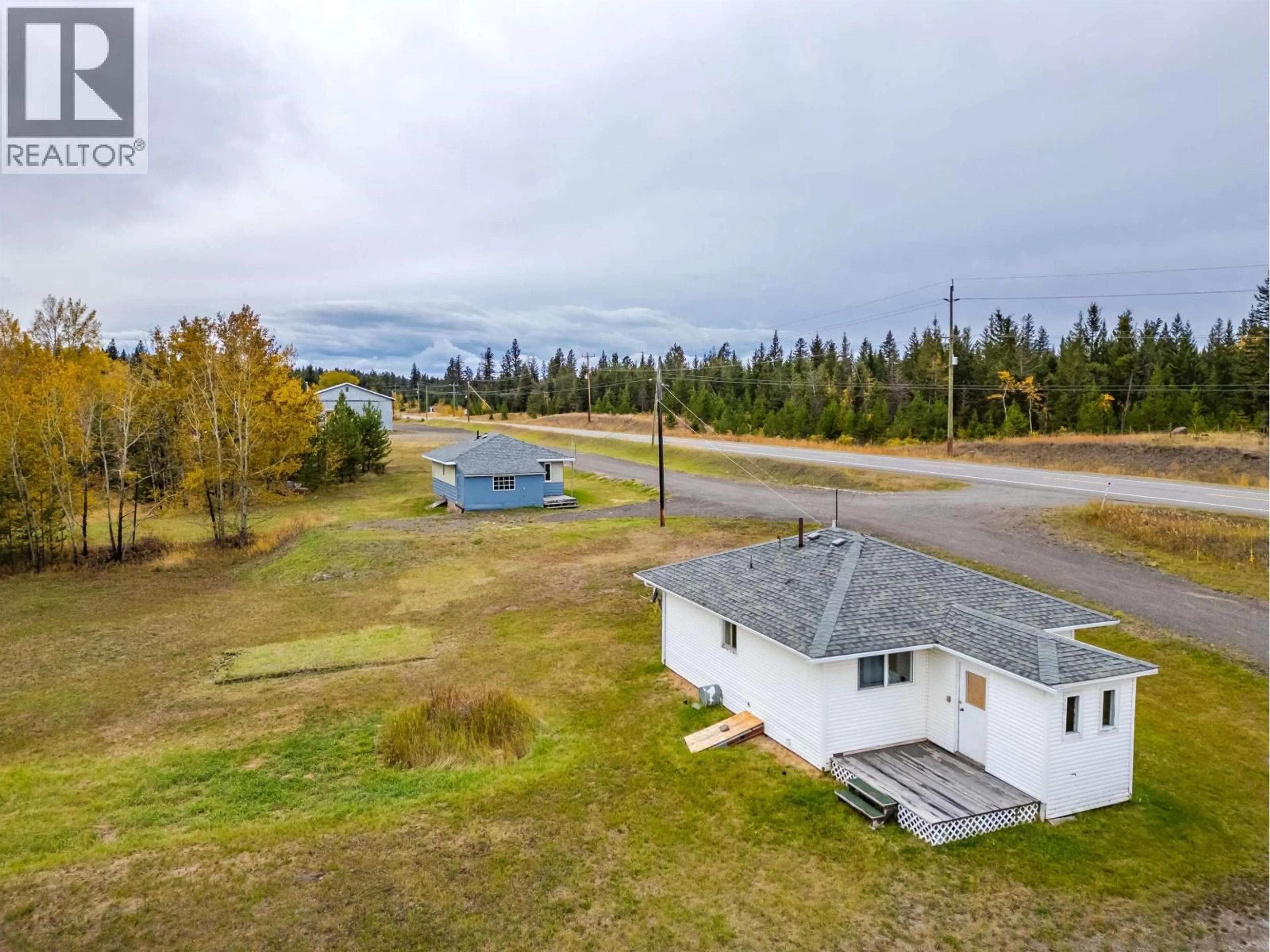 A pic from outside/outdoor area/front of a property/back of a property/a pic from drone, water/lake/river/ocean view for 1208 CARIBOO 97 HIGHWAY, 70 Mile House British Columbia V0K2K0
