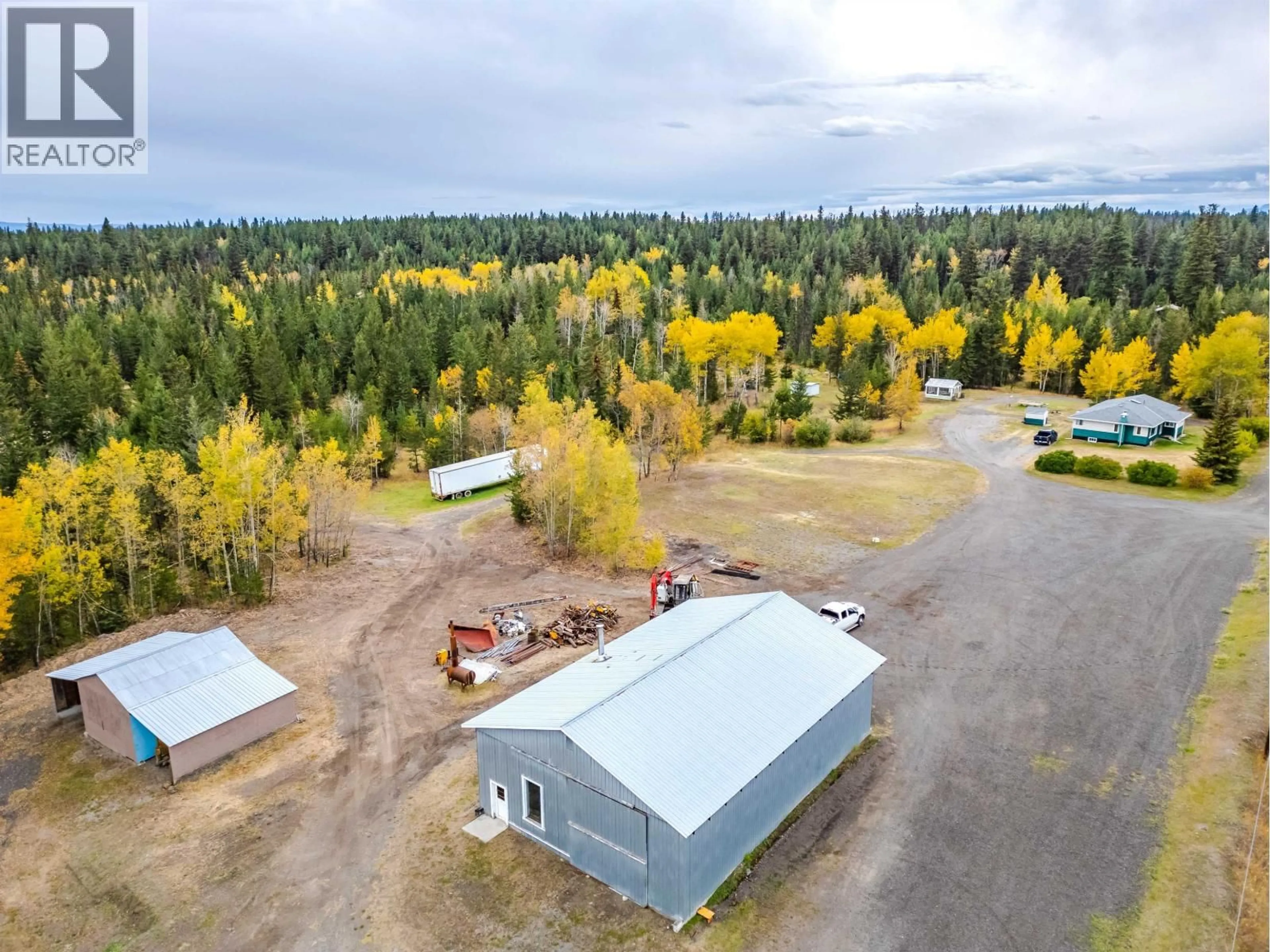A pic from outside/outdoor area/front of a property/back of a property/a pic from drone, forest/trees view for 1208 CARIBOO 97 HIGHWAY, 70 Mile House British Columbia V0K2K0