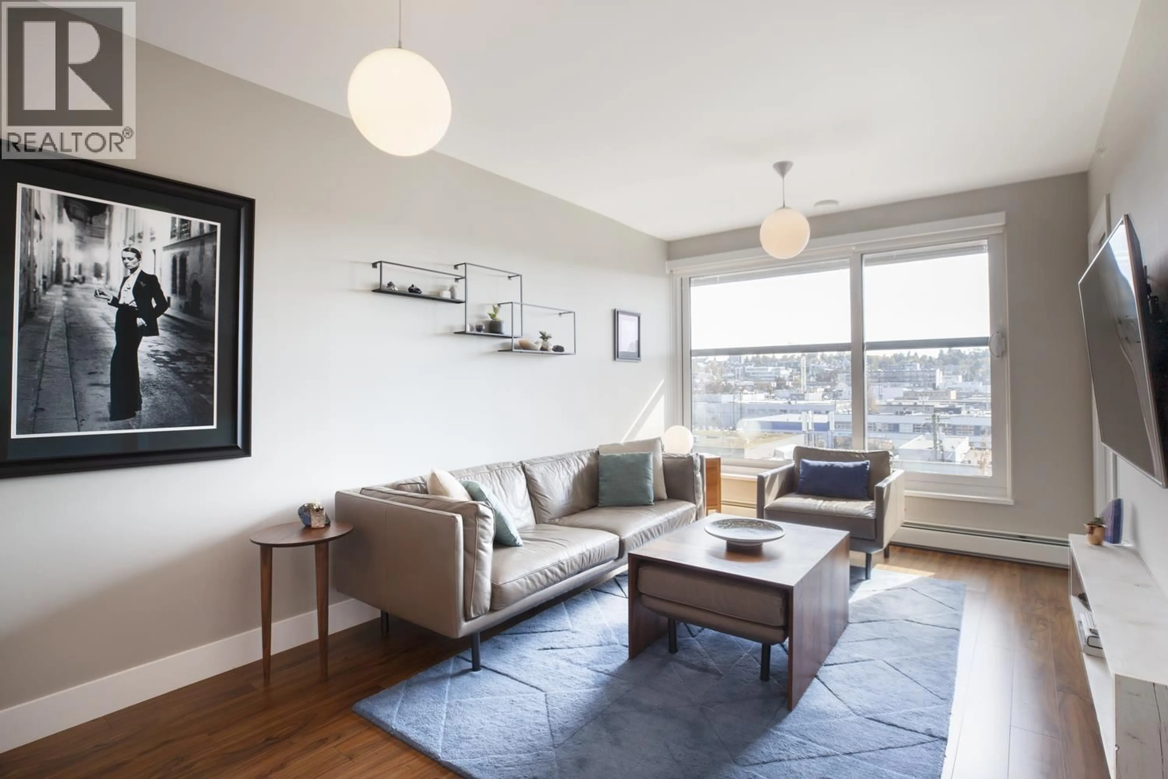 Living room with furniture, wood/laminate floor for 716 - 159 2ND AVENUE, Vancouver British Columbia V5Y0L8