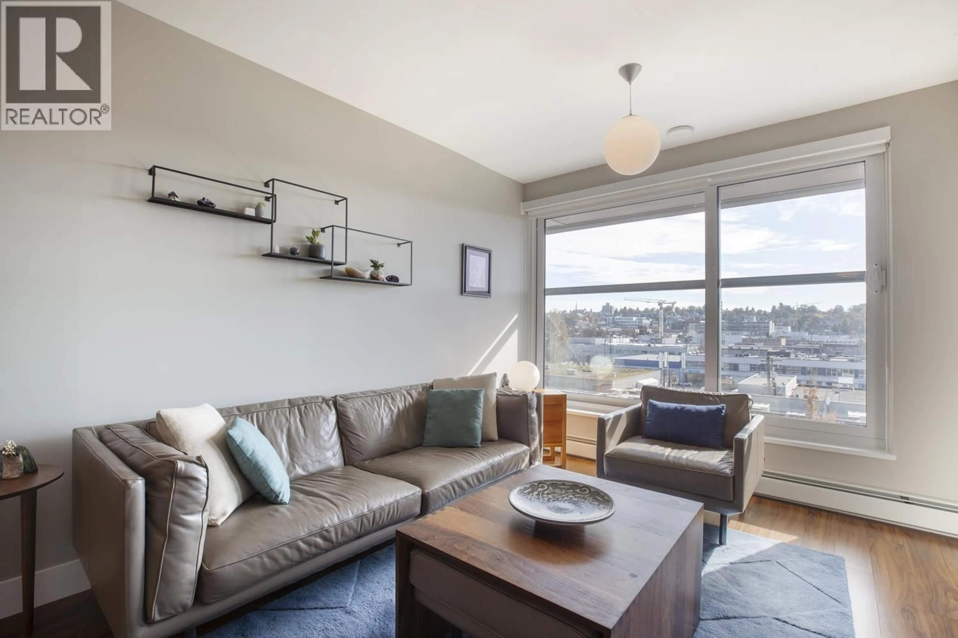 Living room with furniture, wood/laminate floor for 716 - 159 2ND AVENUE, Vancouver British Columbia V5Y0L8