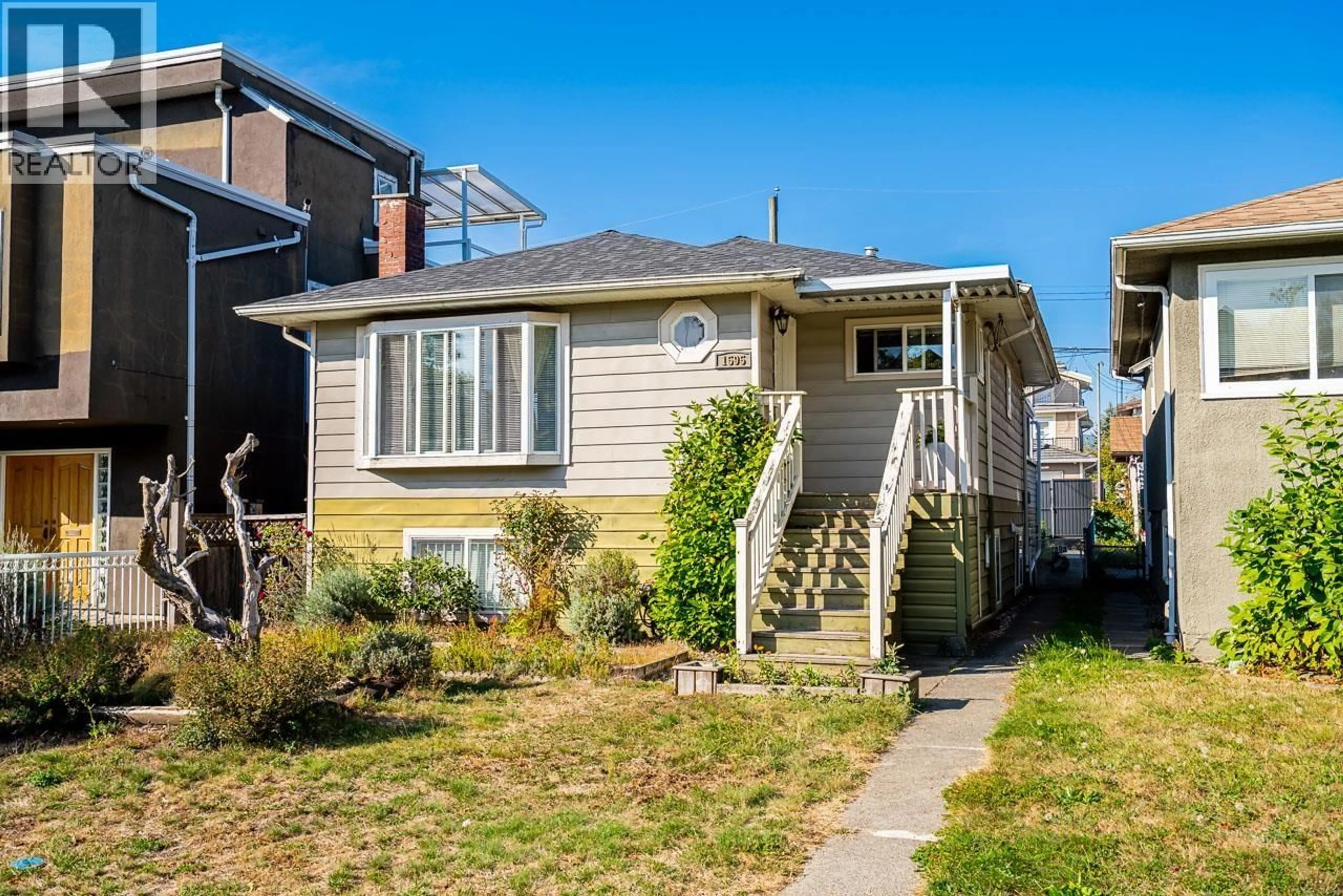 Home with vinyl exterior material, street for 1595 E 36TH AVENUE, Vancouver British Columbia V5P1C3