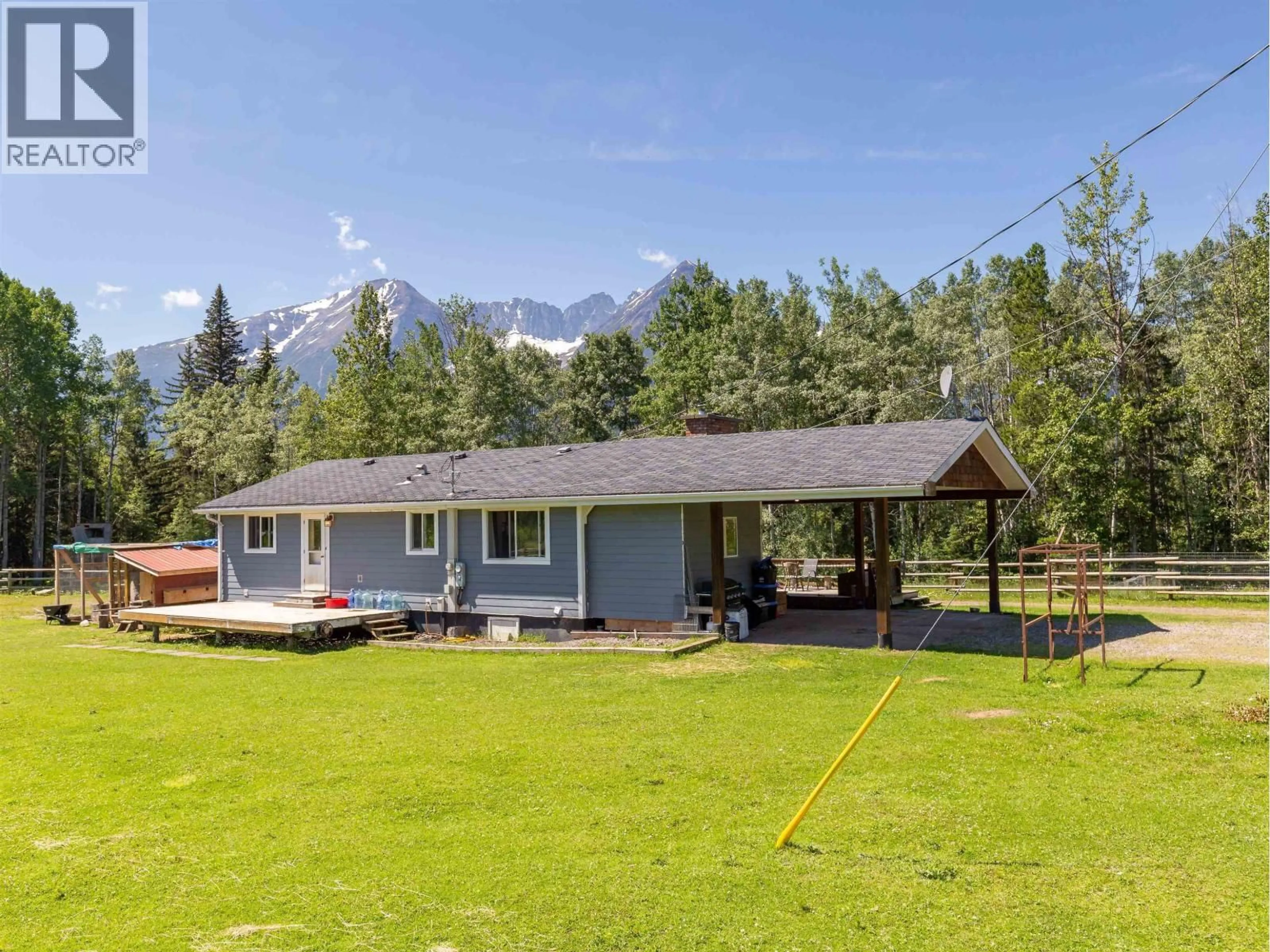 A pic from outside/outdoor area/front of a property/back of a property/a pic from drone, mountain view for 5933 RACEWAY ROAD, Smithers British Columbia V0J2N1