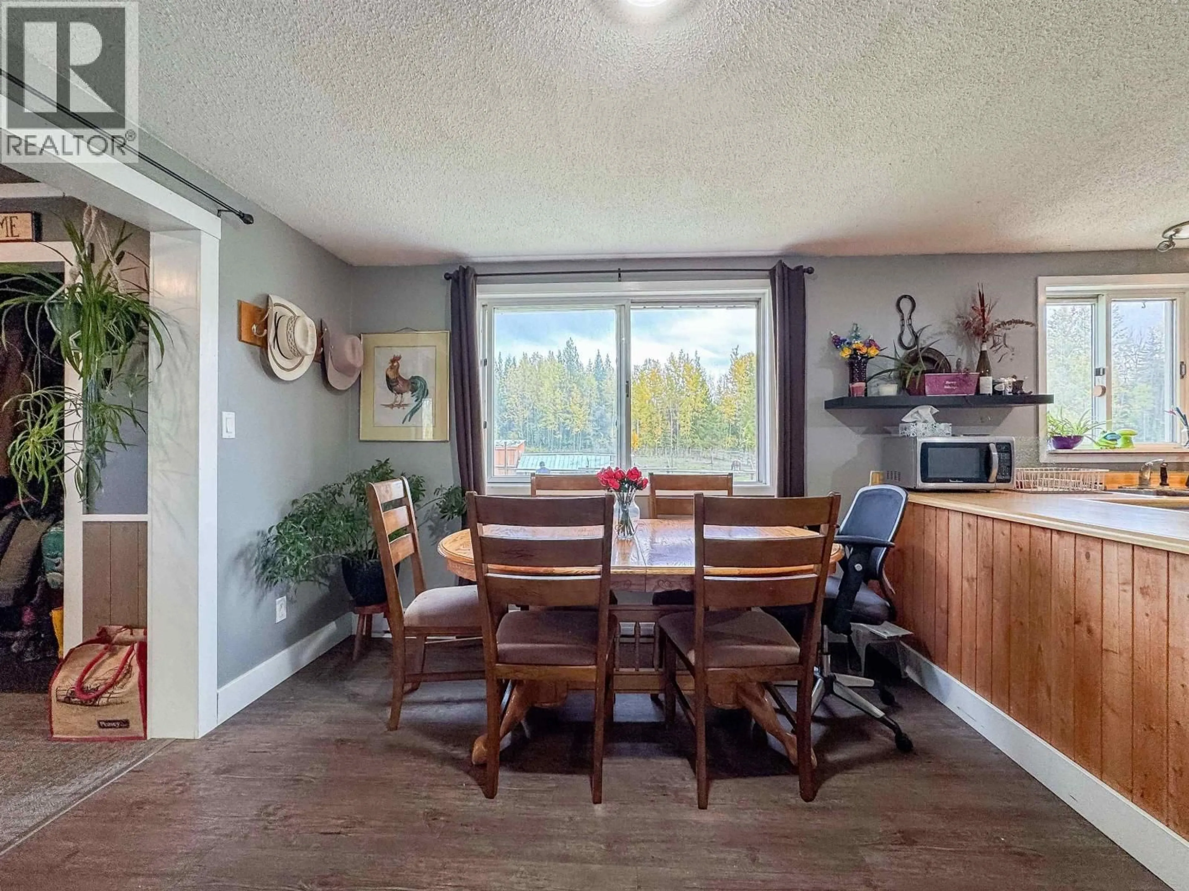 Dining room, wood/laminate floor for 5933 RACEWAY ROAD, Smithers British Columbia V0J2N1