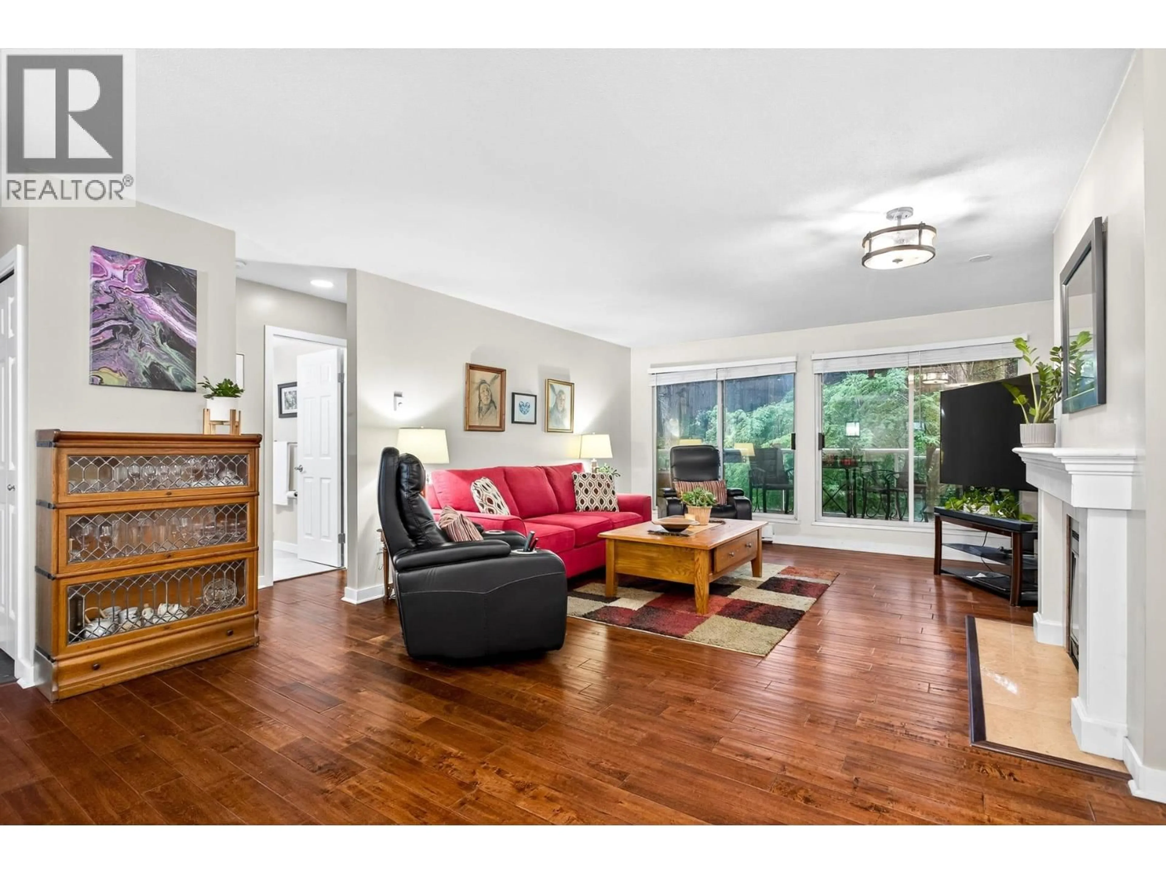 Living room with furniture, wood/laminate floor for 305 - 2733 ATLIN PLACE, Coquitlam British Columbia V3C5B1