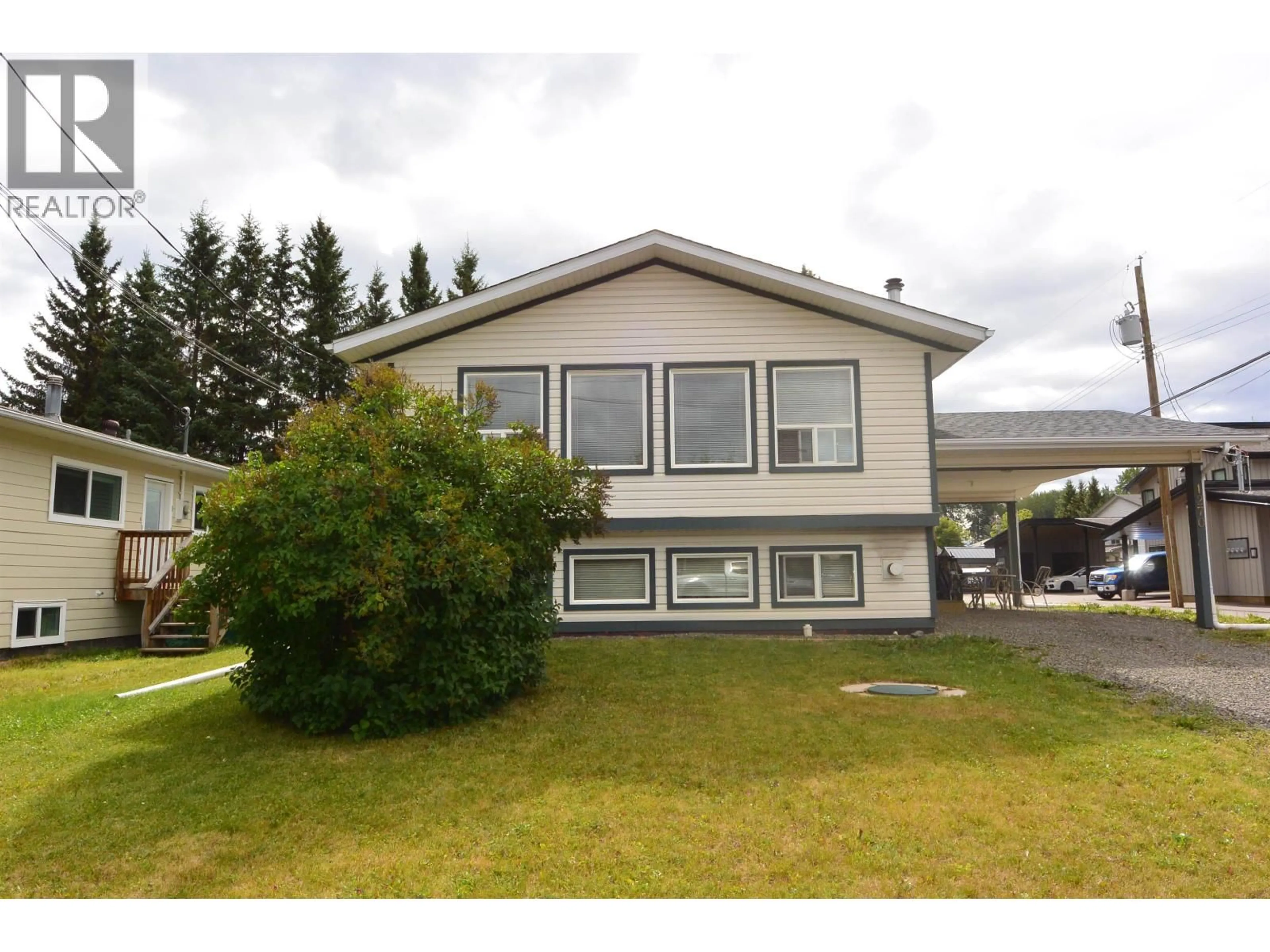 Home with vinyl exterior material, street for 1276 DOMINION STREET, Smithers British Columbia V0J2N0