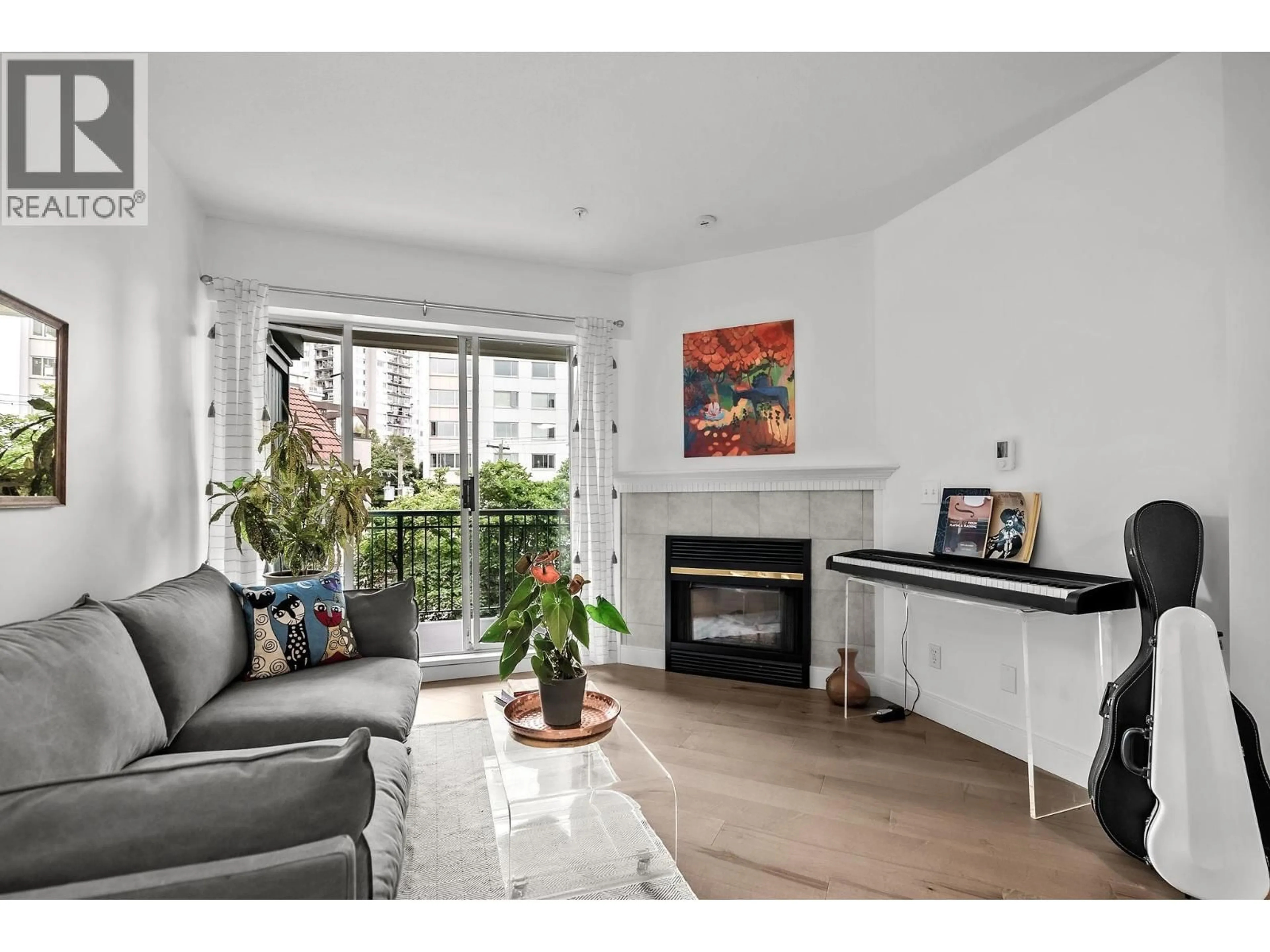 Living room with furniture, wood/laminate floor for 304 - 1928 NELSON STREET, Vancouver British Columbia V6G1N2