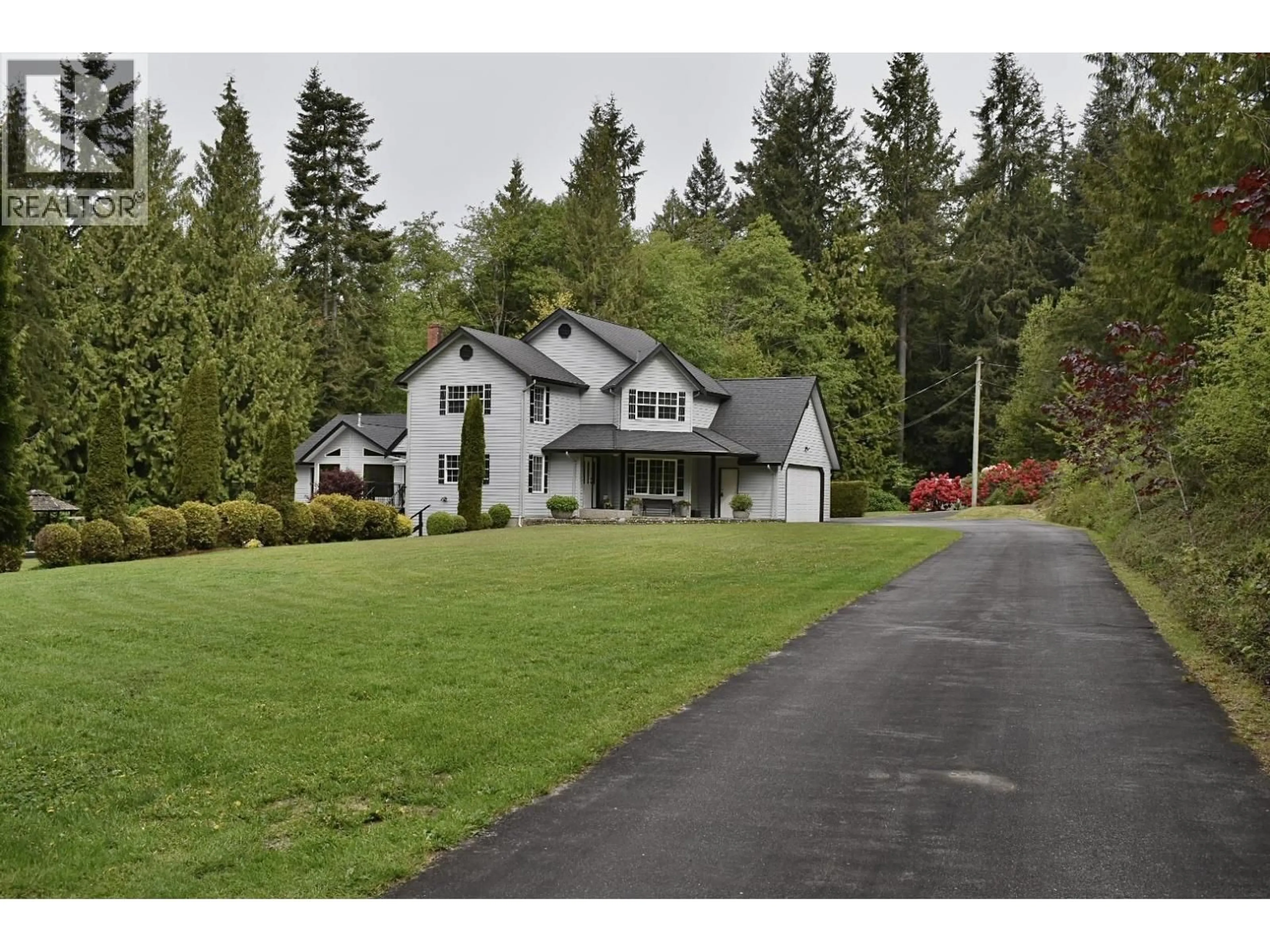 Home with vinyl exterior material, street for 1499 HANBURY ROAD, Roberts Creek British Columbia V0N2W1