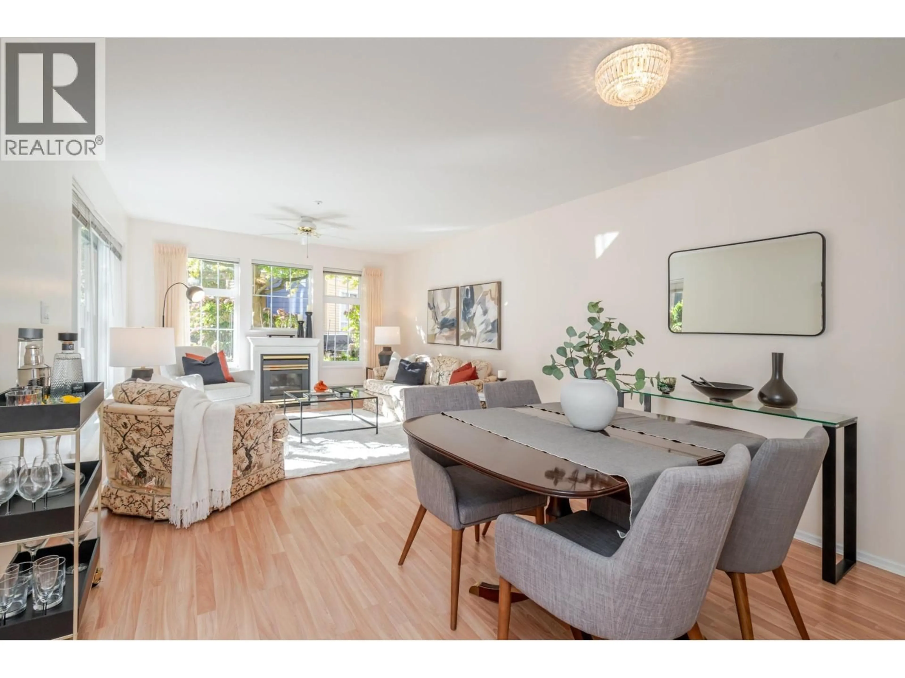 Living room with furniture, wood/laminate floor for 108 - 5556 14TH AVENUE, Tsawwassen British Columbia V4M4E7