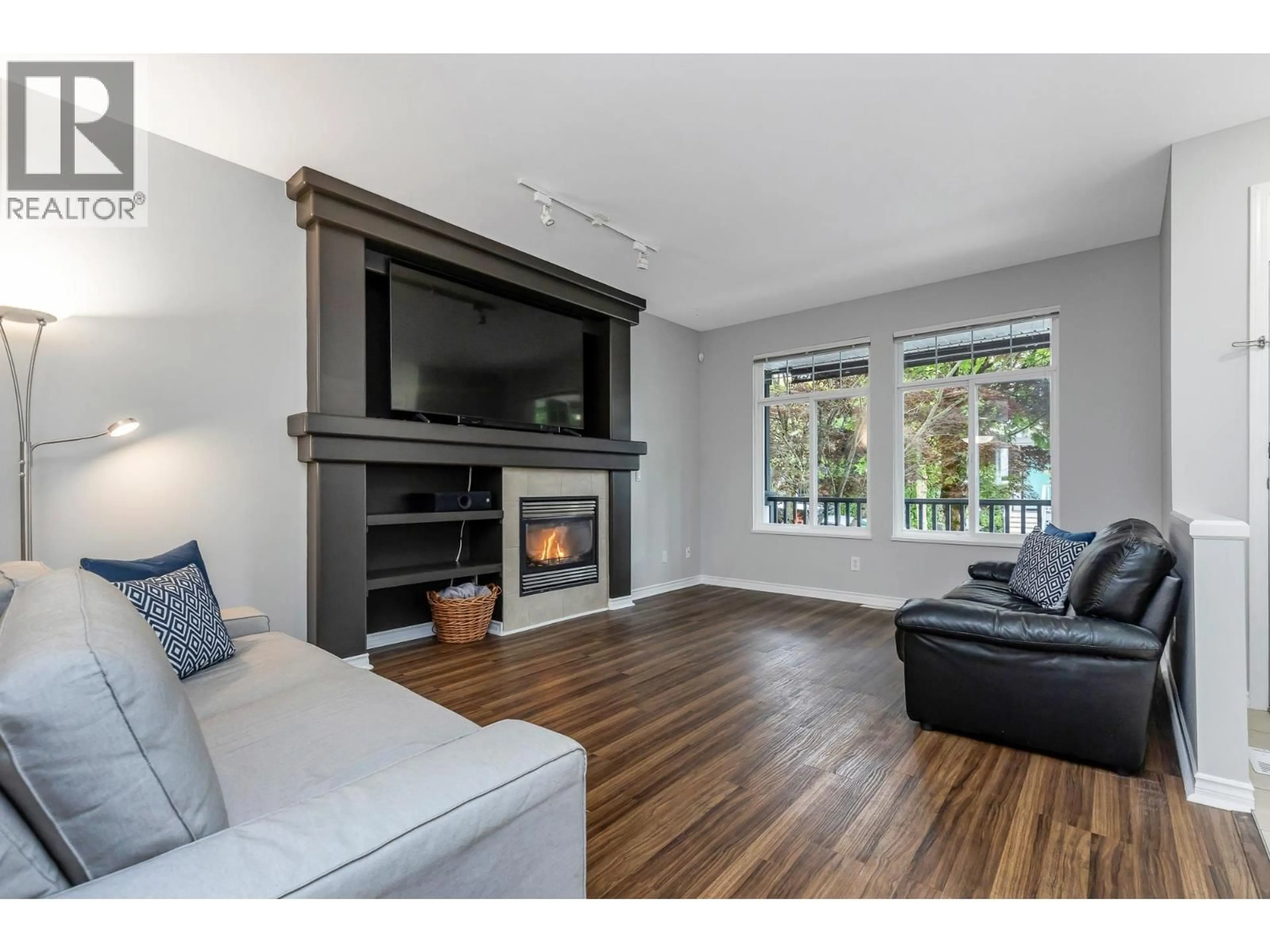 Living room with furniture, wood/laminate floor for 24119 102A AVENUE, Maple Ridge British Columbia V2W2B3