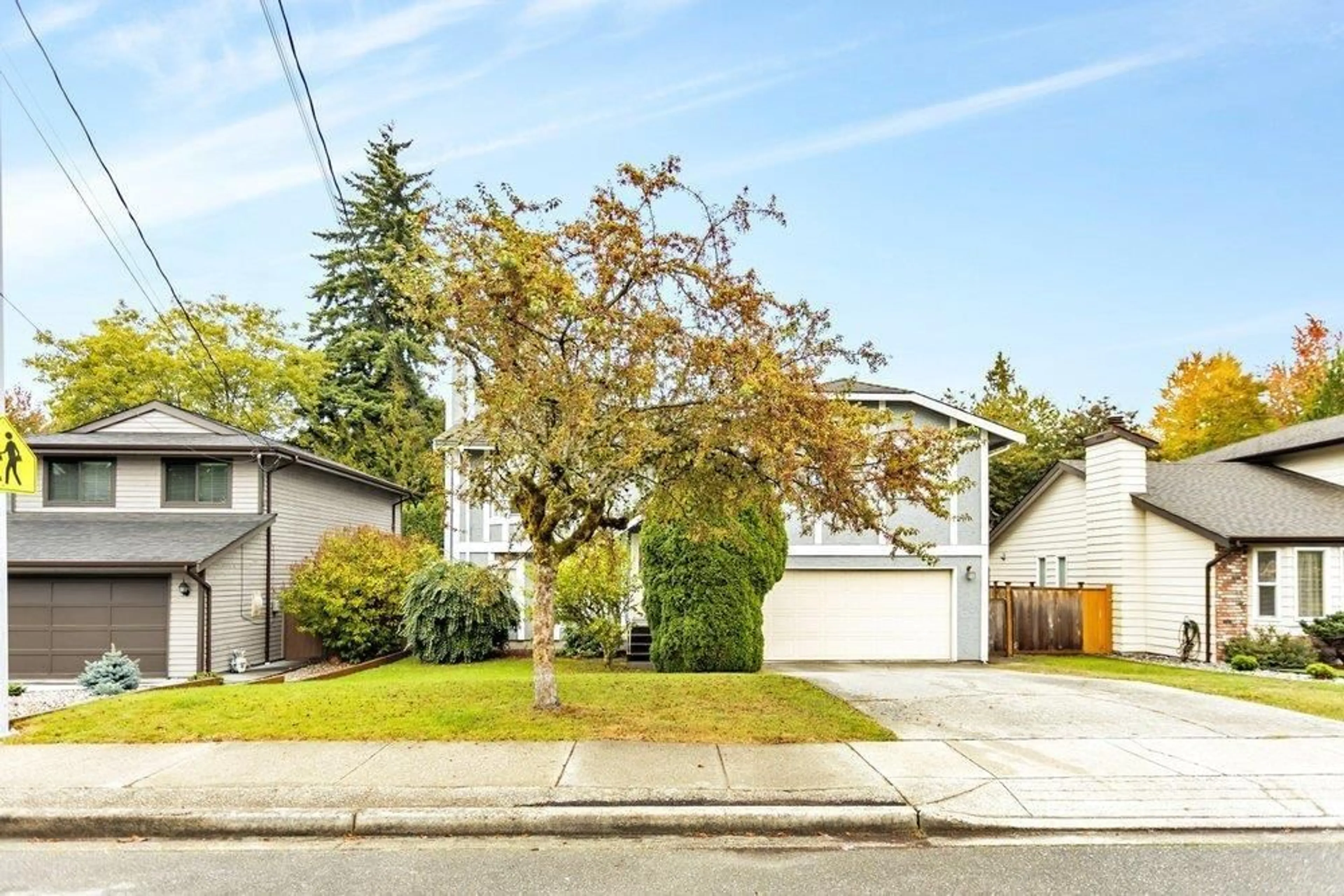 Home with vinyl exterior material, street for 9766 154, Surrey British Columbia V3R7J1