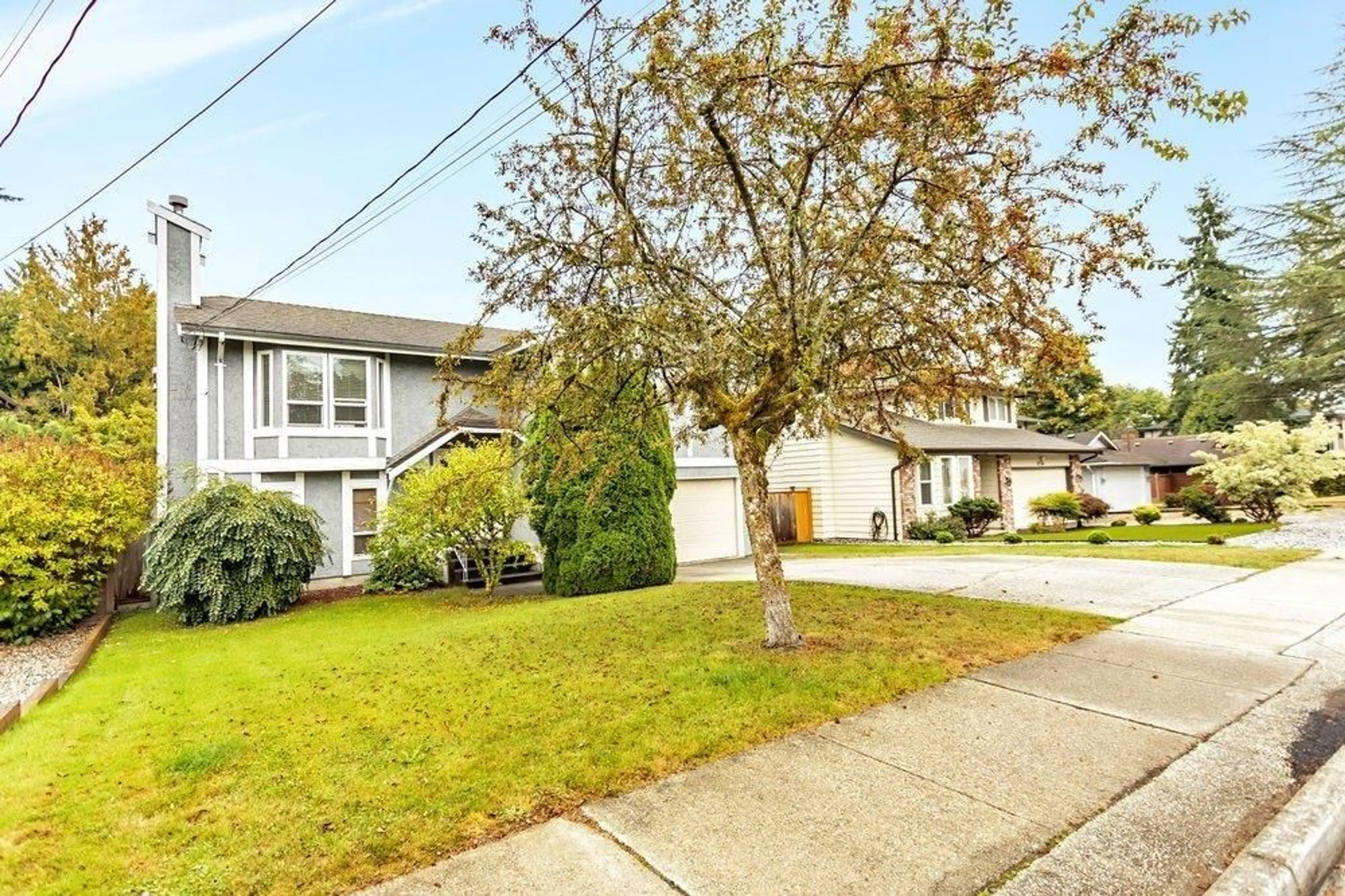 Home with vinyl exterior material, street for 9766 154, Surrey British Columbia V3R7J1