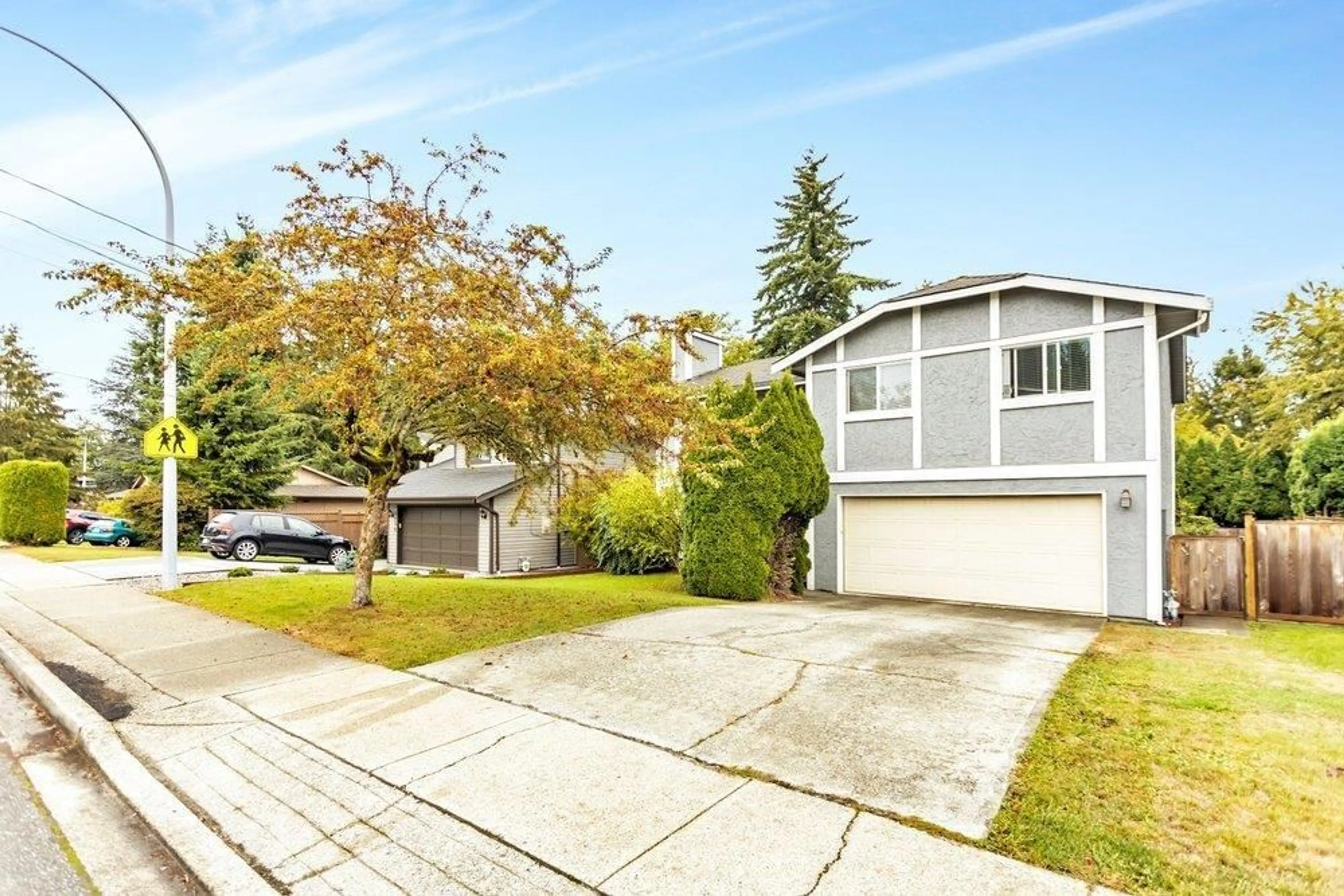 Home with vinyl exterior material, street for 9766 154, Surrey British Columbia V3R7J1