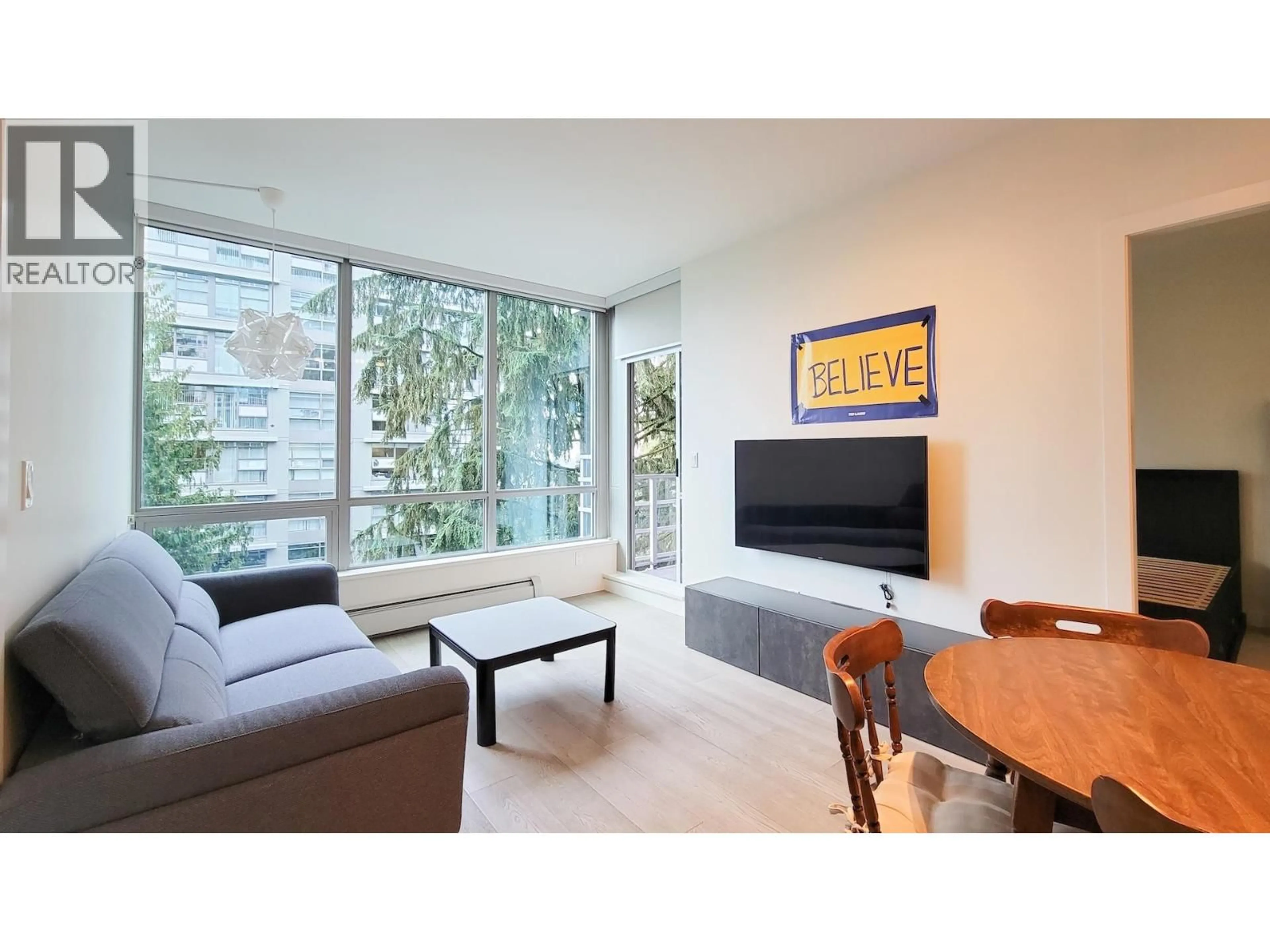 Living room with furniture, unknown for 706 - 9080 UNIVERSITY CRESCENT, Burnaby British Columbia V5A0B7