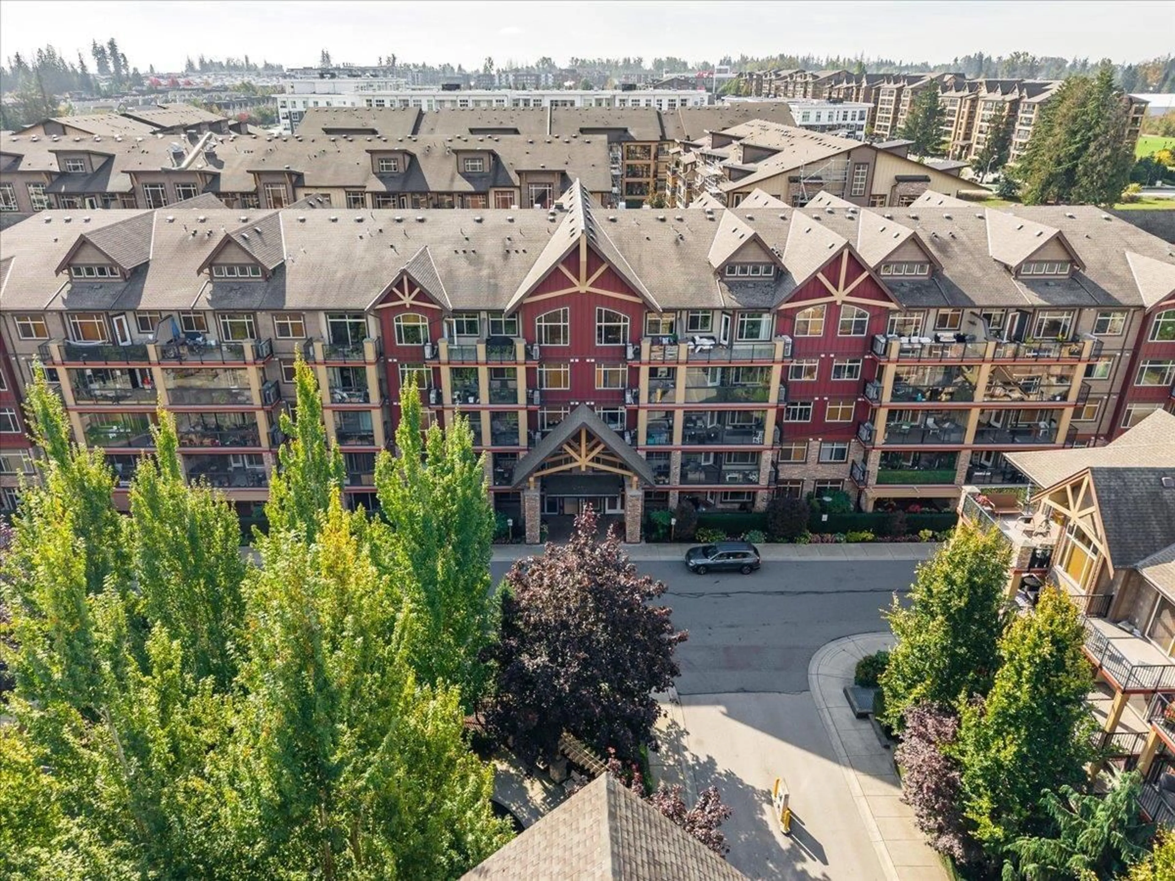 A pic from outside/outdoor area/front of a property/back of a property/a pic from drone, city buildings view from balcony for 225 - 8288 207A, Langley British Columbia V2Y0L2