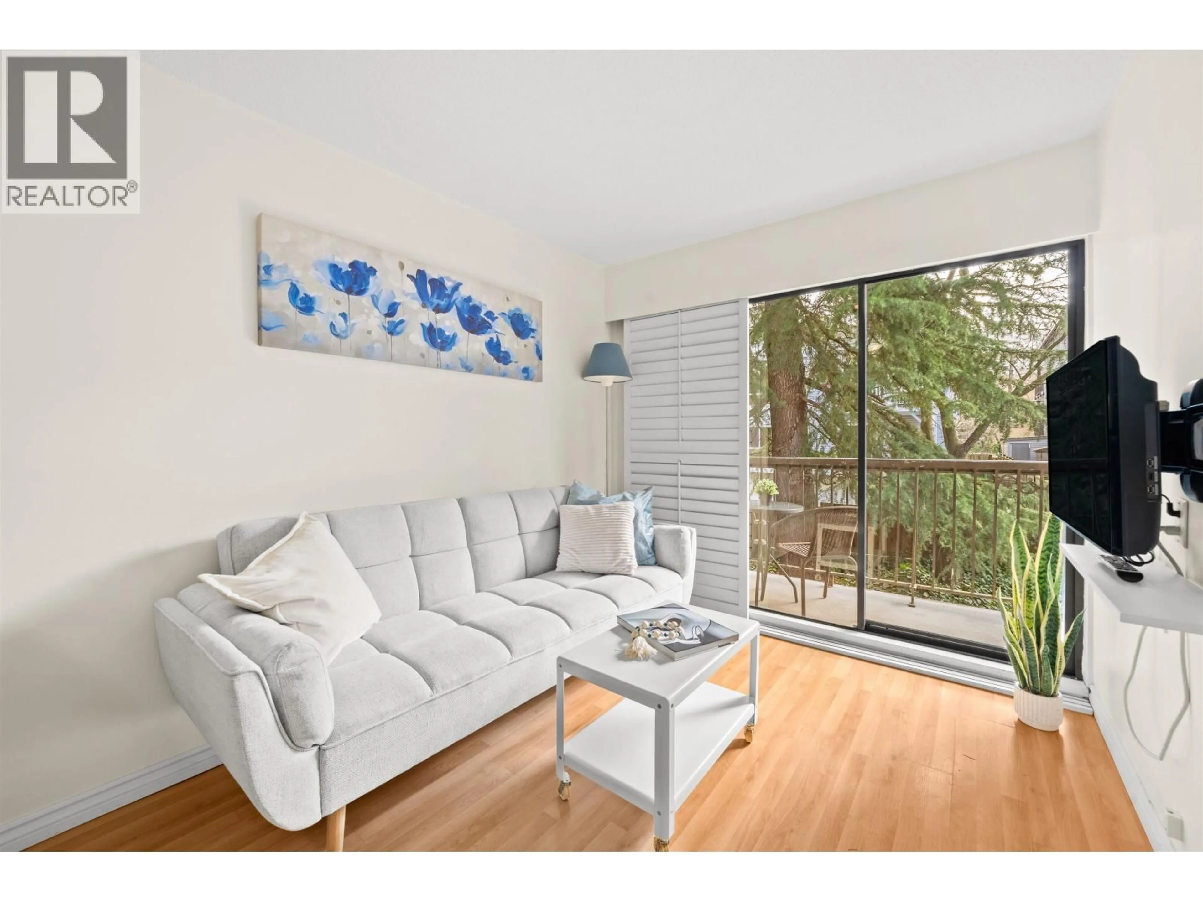 Living room with furniture, wood/laminate floor for 208 - 2330 MAPLE STREET, Vancouver British Columbia V6J3T6