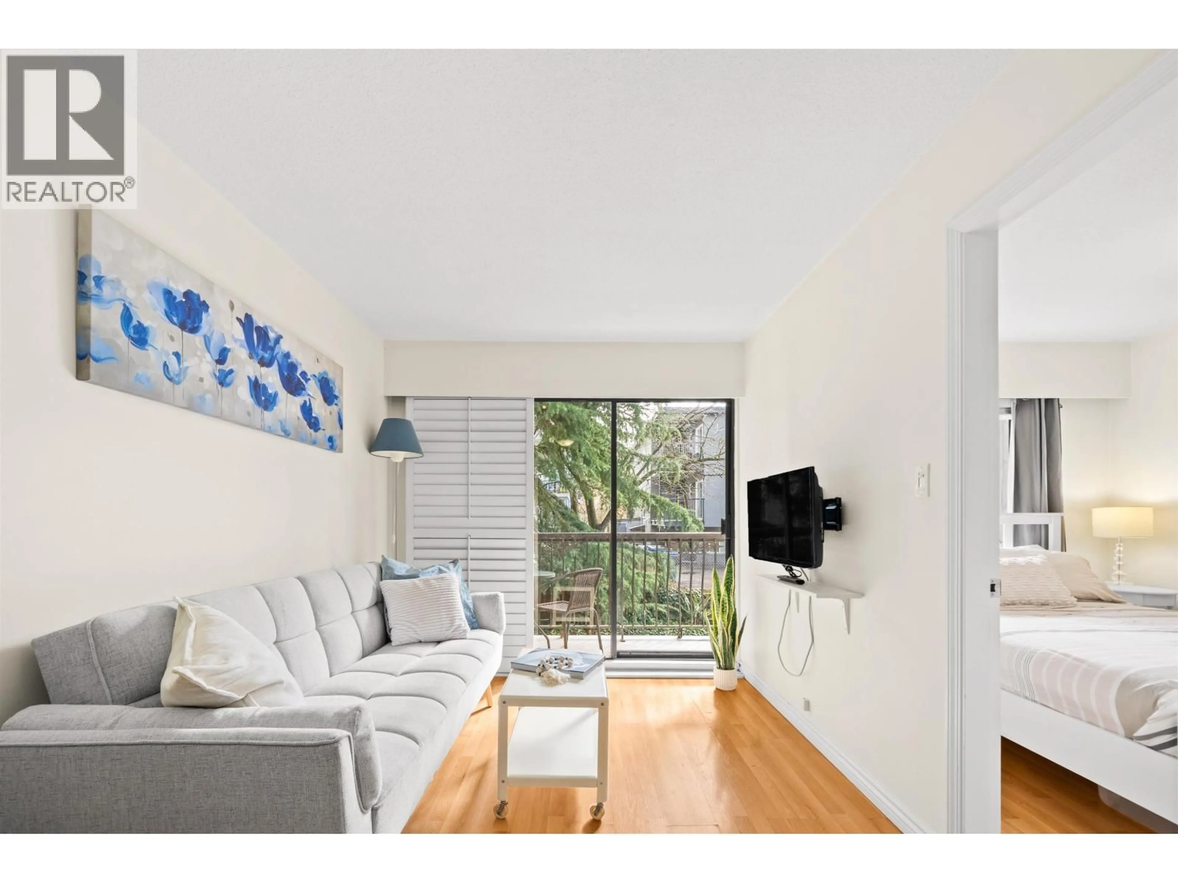 Living room with furniture, wood/laminate floor for 208 - 2330 MAPLE STREET, Vancouver British Columbia V6J3T6