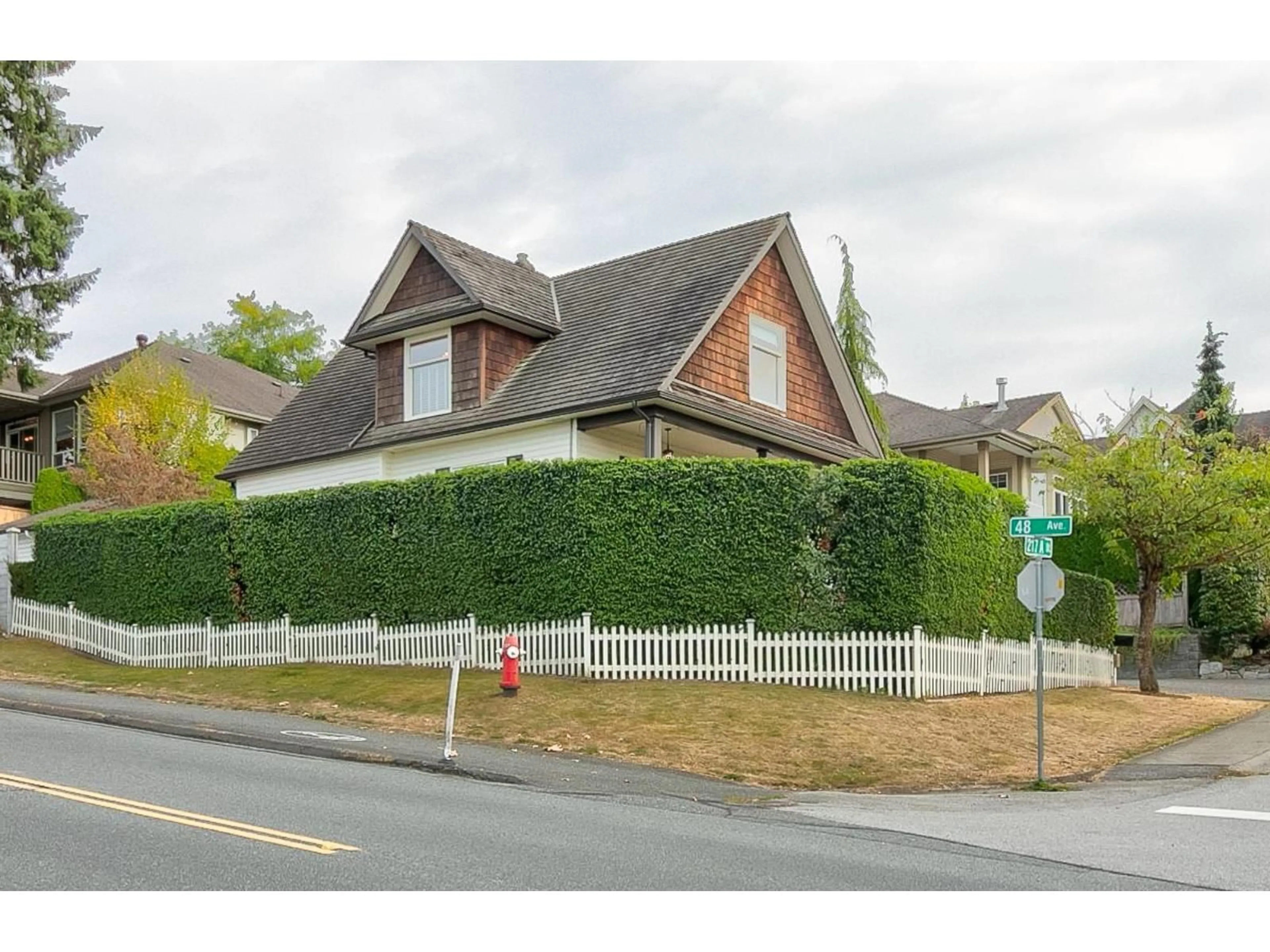 A pic from outside/outdoor area/front of a property/back of a property/a pic from drone, street for 4786 217A, Langley British Columbia V3A2N7