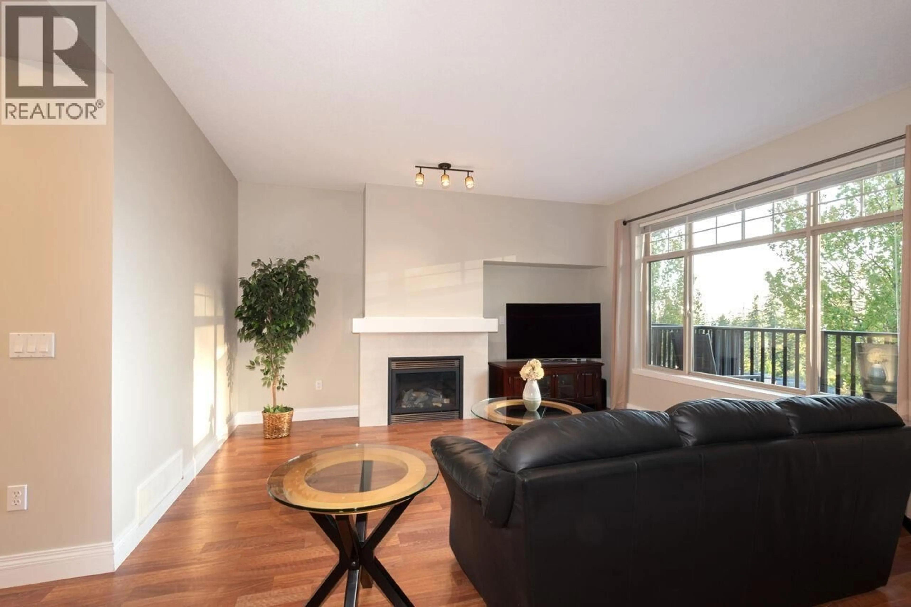 Living room with furniture, wood/laminate floor for 95 - 55 HAWTHORN DRIVE, Port Moody British Columbia V3H0B3