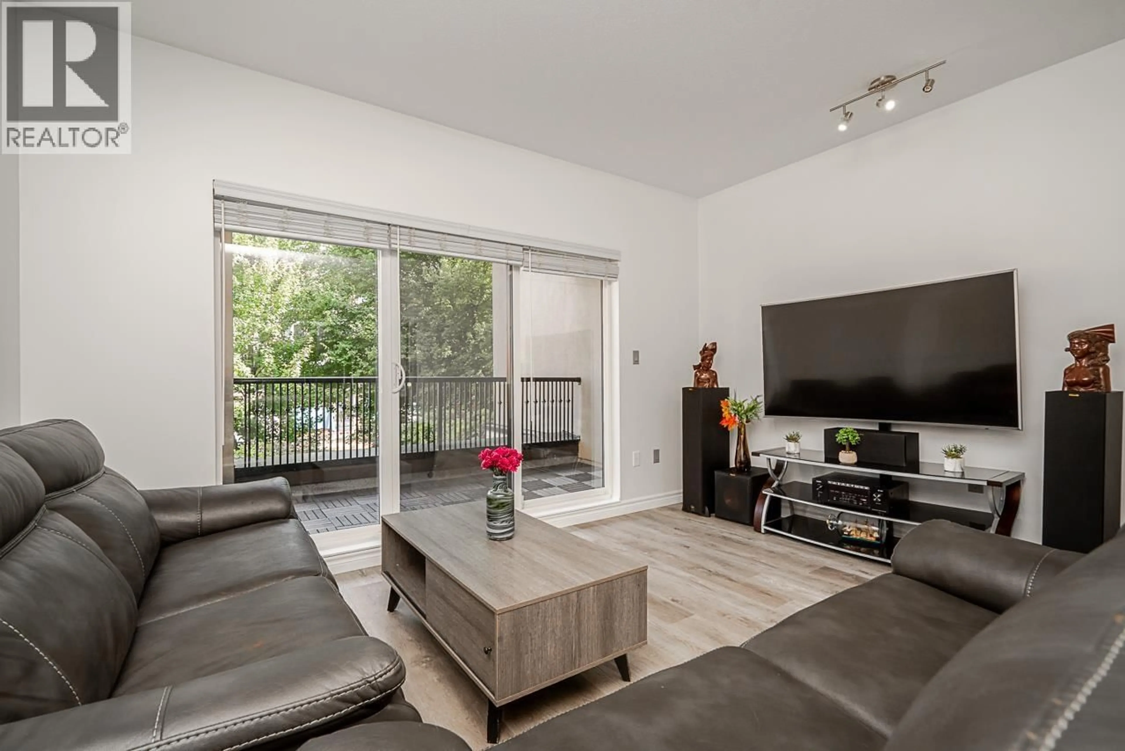 Living room with furniture, wood/laminate floor for 213 - 2478 WELCHER AVENUE, Port Coquitlam British Columbia V3C0A6